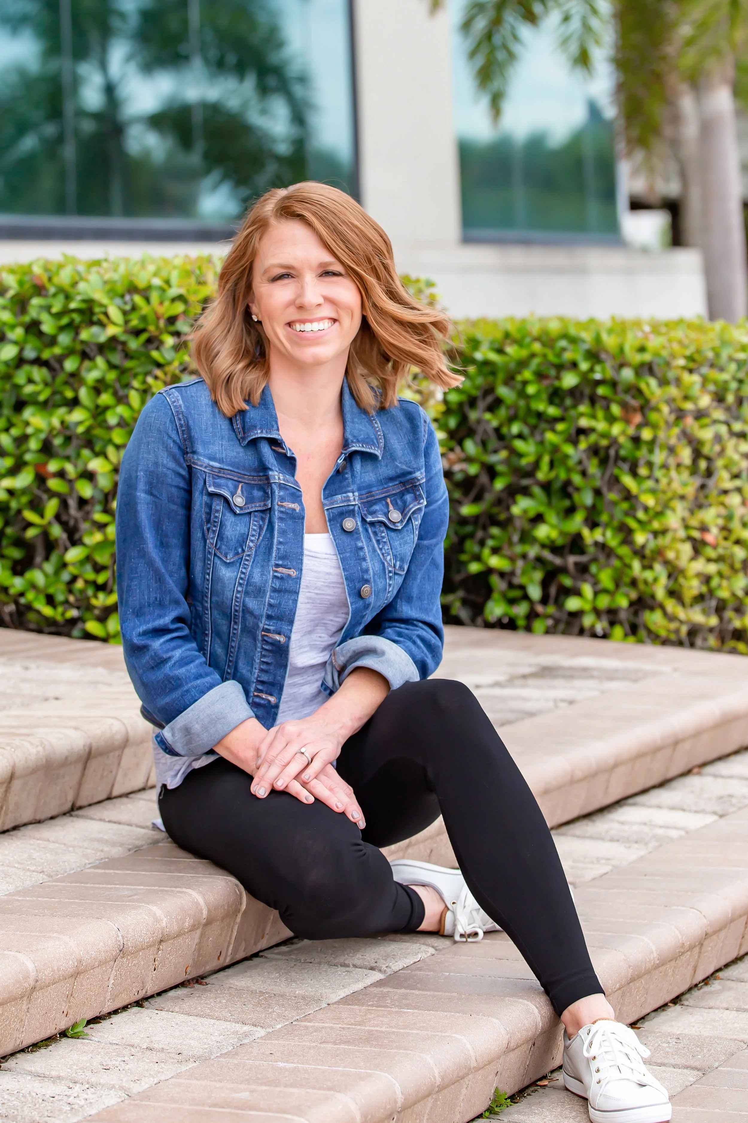 smiling therapist sitting outdoors