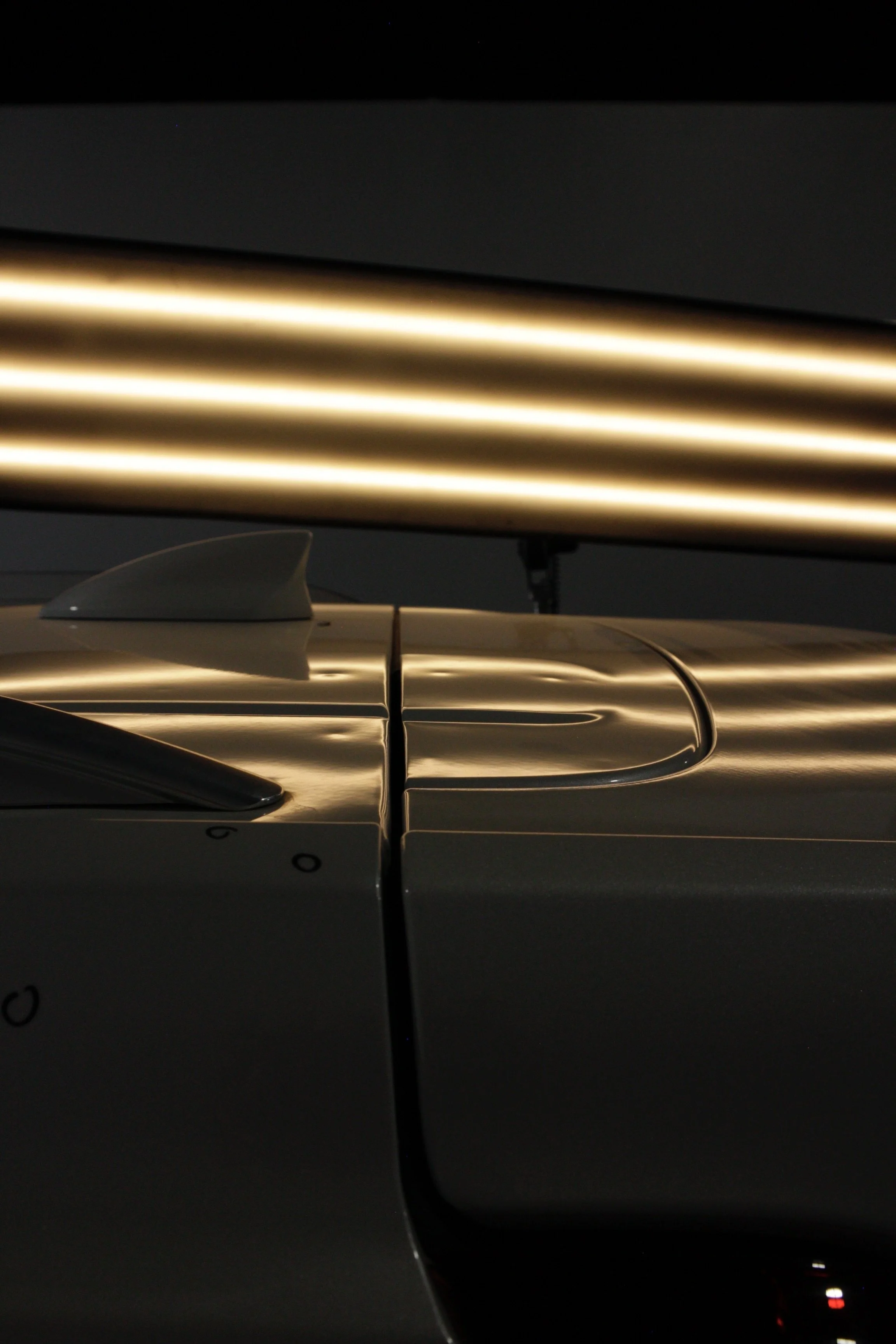 Specialized lighting used to reveal hail damage, helping our technicians clearly see dents and restore the vehicle accurately.