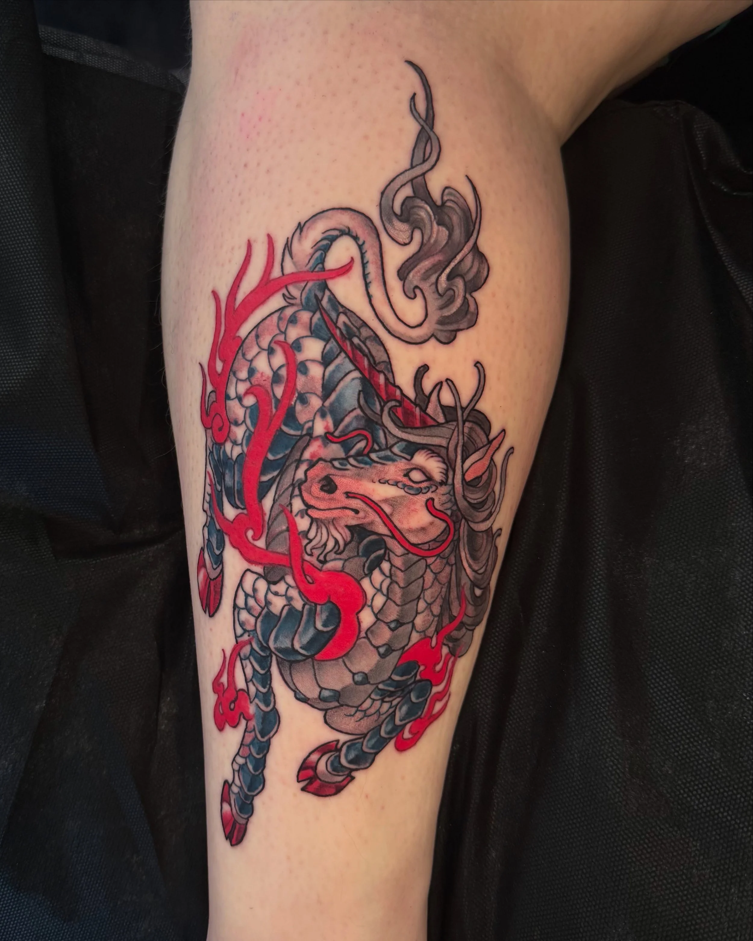 kirin tattoo from my predrawns for jessi! i made a few changes to the design per our consult&mdash; a little more horse-y, more traditional unicorn like mane &amp; tail, and since the predrawn was a sketch, we were able to pick colours we liked. lovi