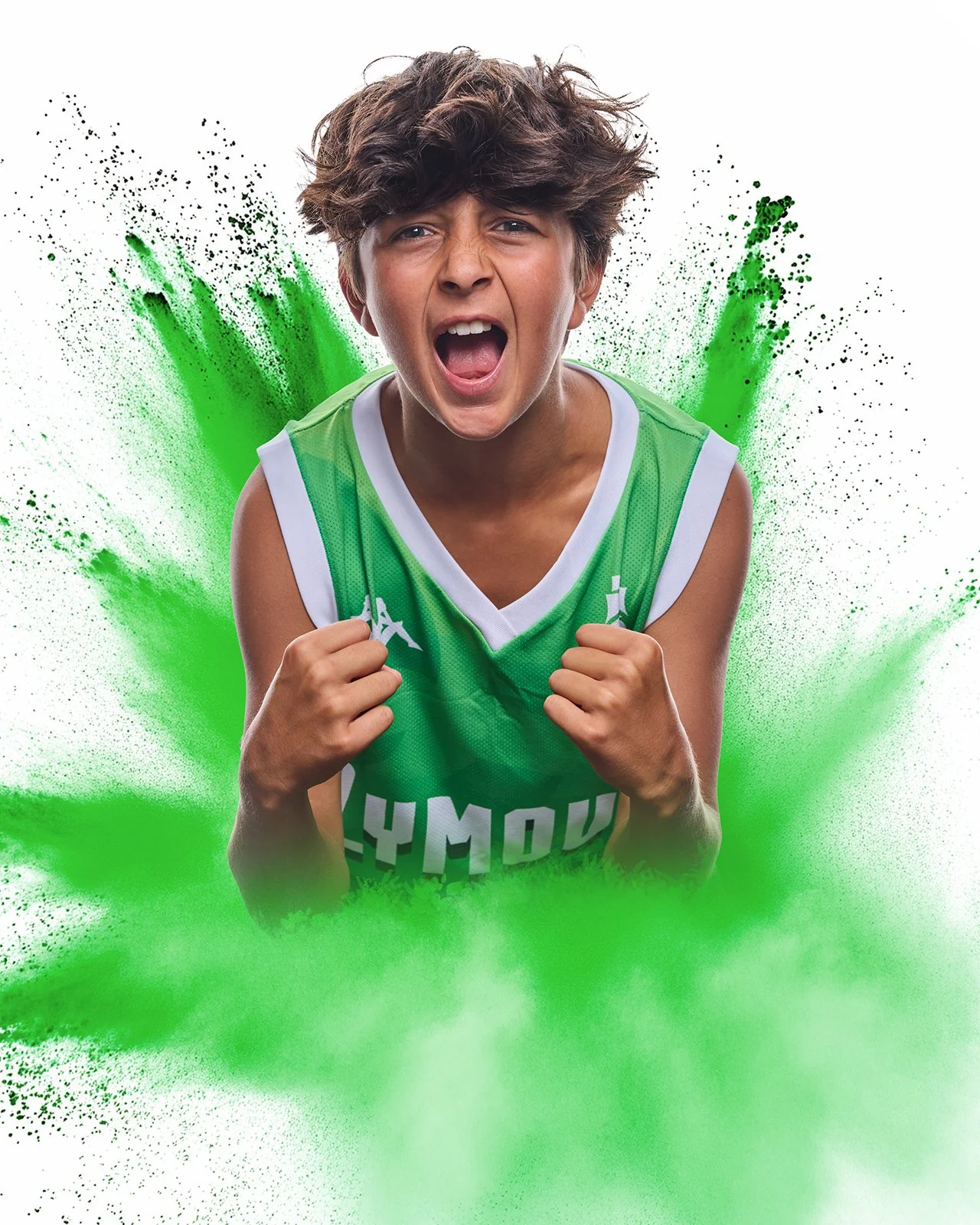 A creative portrait of a young basketball player celebrating