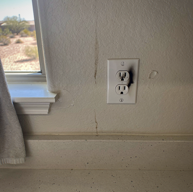 scorched electrical outlet with black burn marks