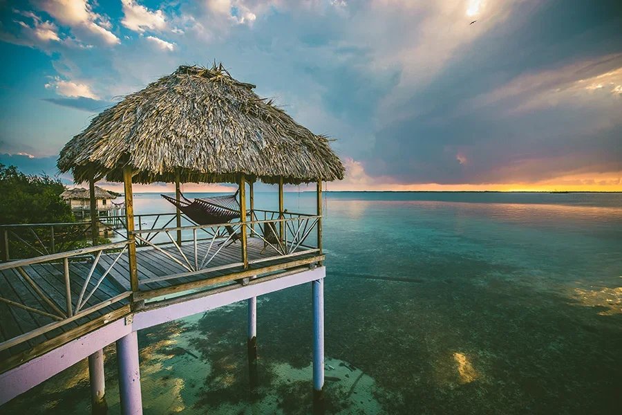 Overwater bungalow in Belize at sunrise