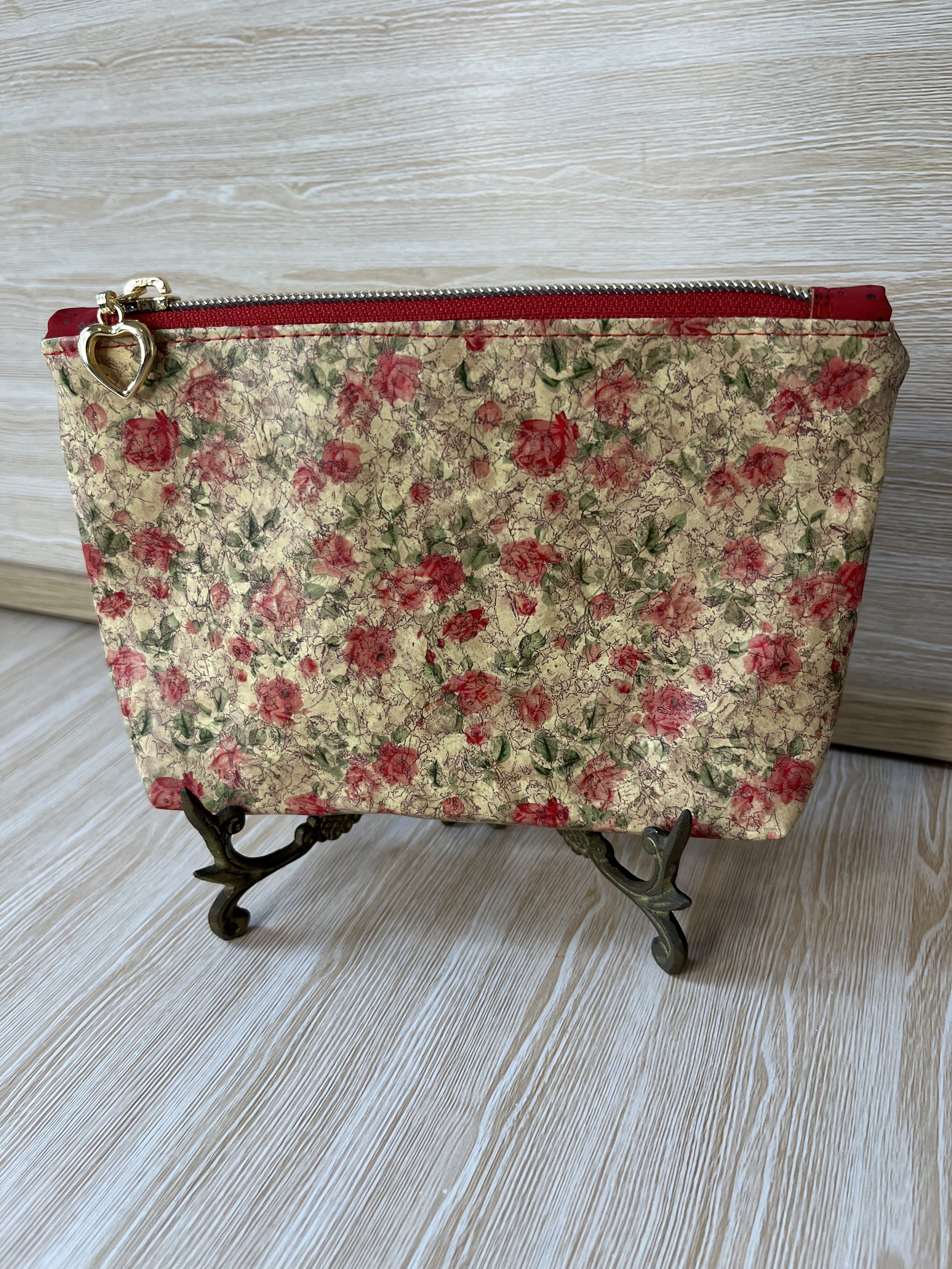 Rose vinyl zipper pouch.