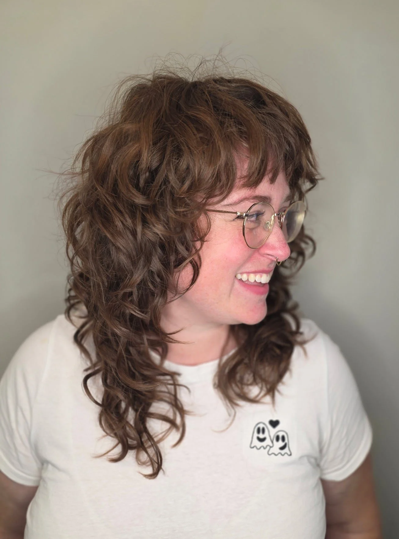 Curly brown hair Deva cut.