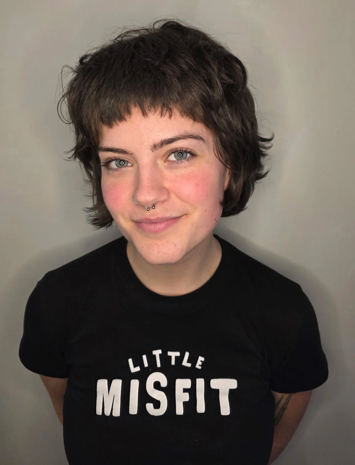 Curly hair cut for short hair.