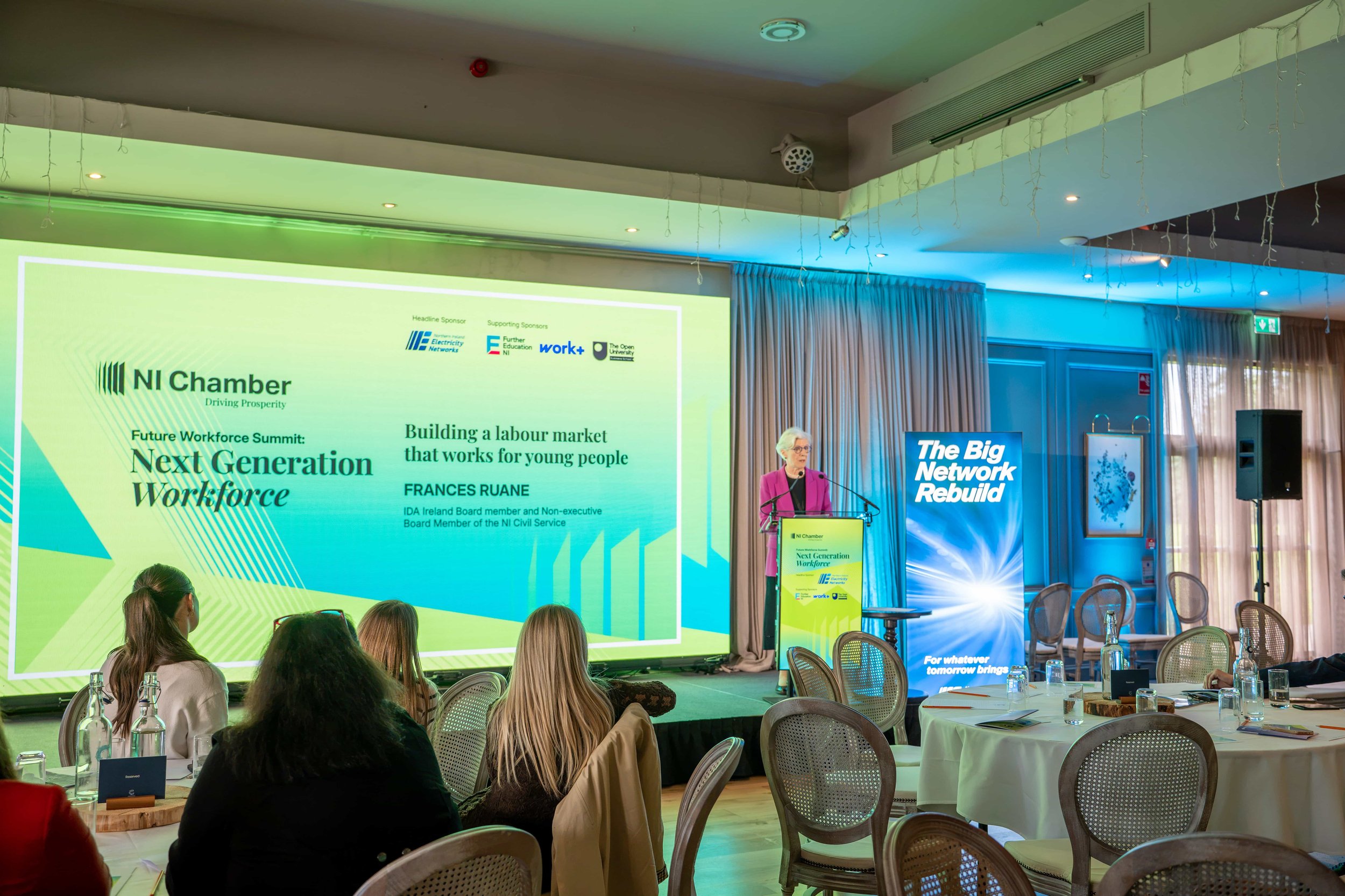 Speaker at a branded digital lectern beside a 5m LED wall at the NI Chamber Future Workforce Summit in Bangor