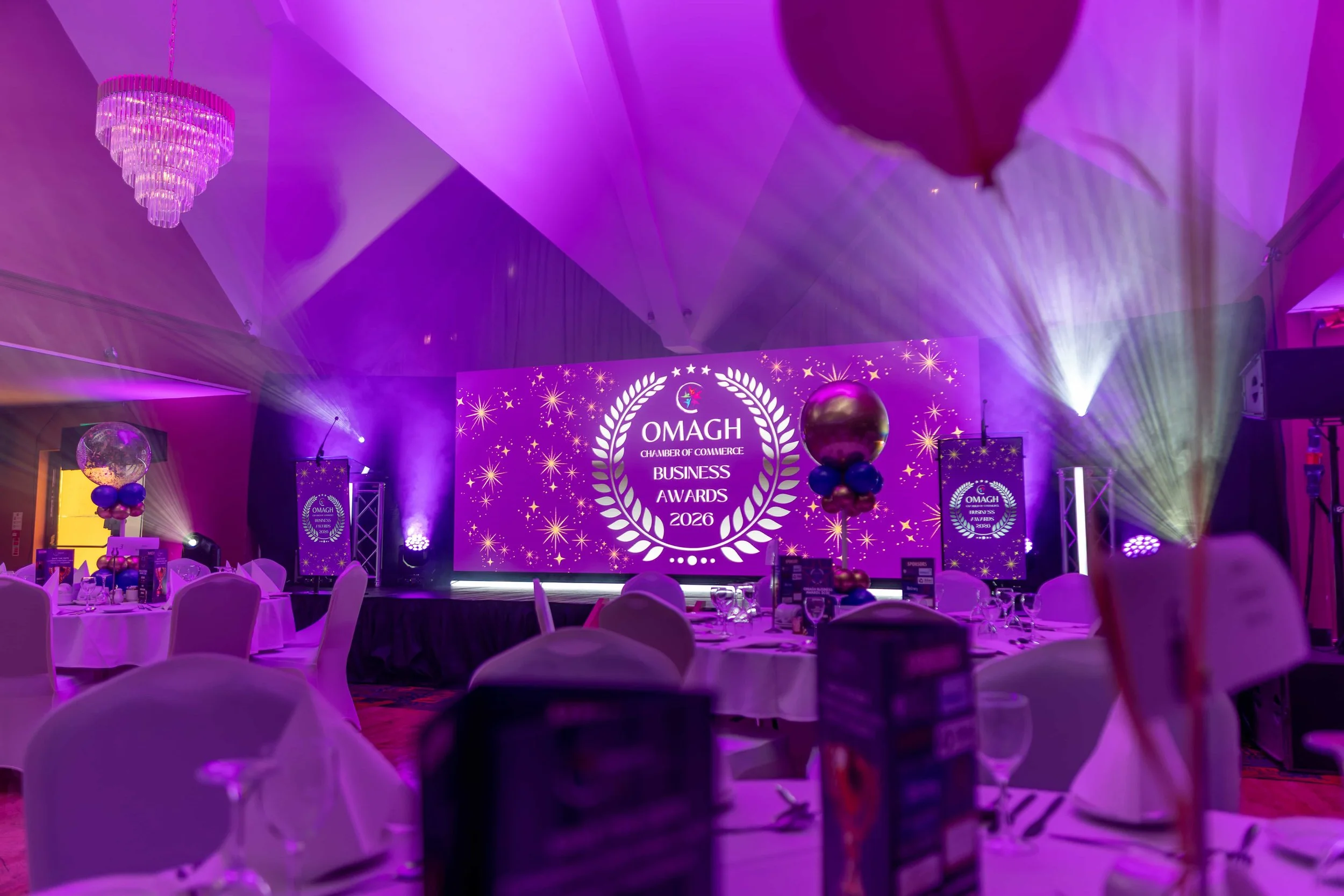 Awards stage with a 5m LED wall, two digital lecterns and moving light beams through haze, Canavan's of Garvaghy