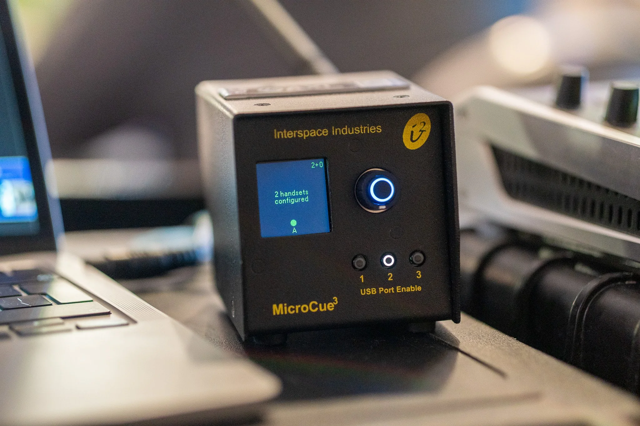 Interspace MicroCue3 wireless slide control receiver with two handsets configured for presenters at the Newry conference.