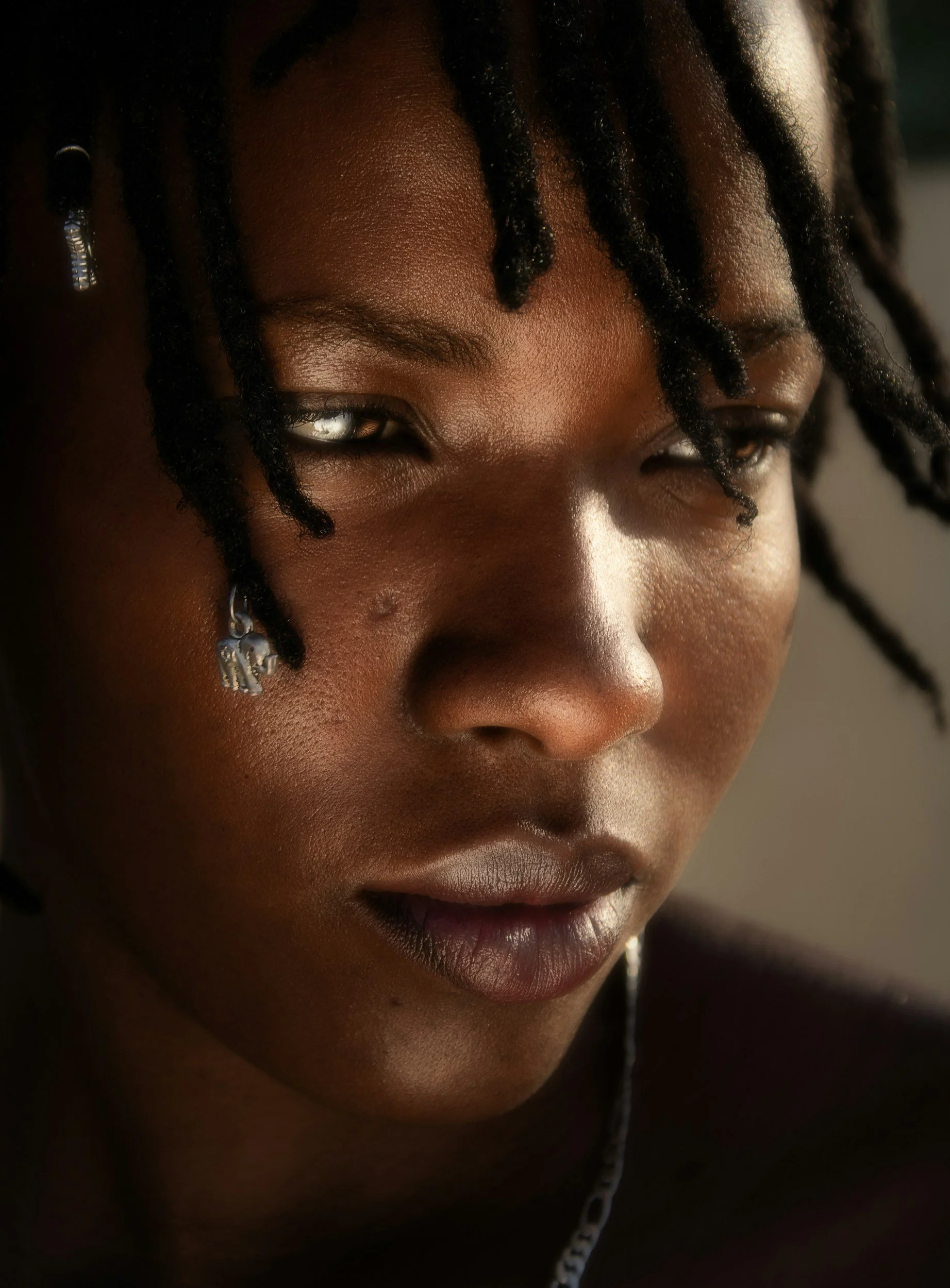 Sad Black teen with drawing of teardrop on their face. It's so hard when your child or teen suffers from ARFID. Get eating disorder therapy from top San Diego therapist Dr Marianne Miller who works with anyone in California.