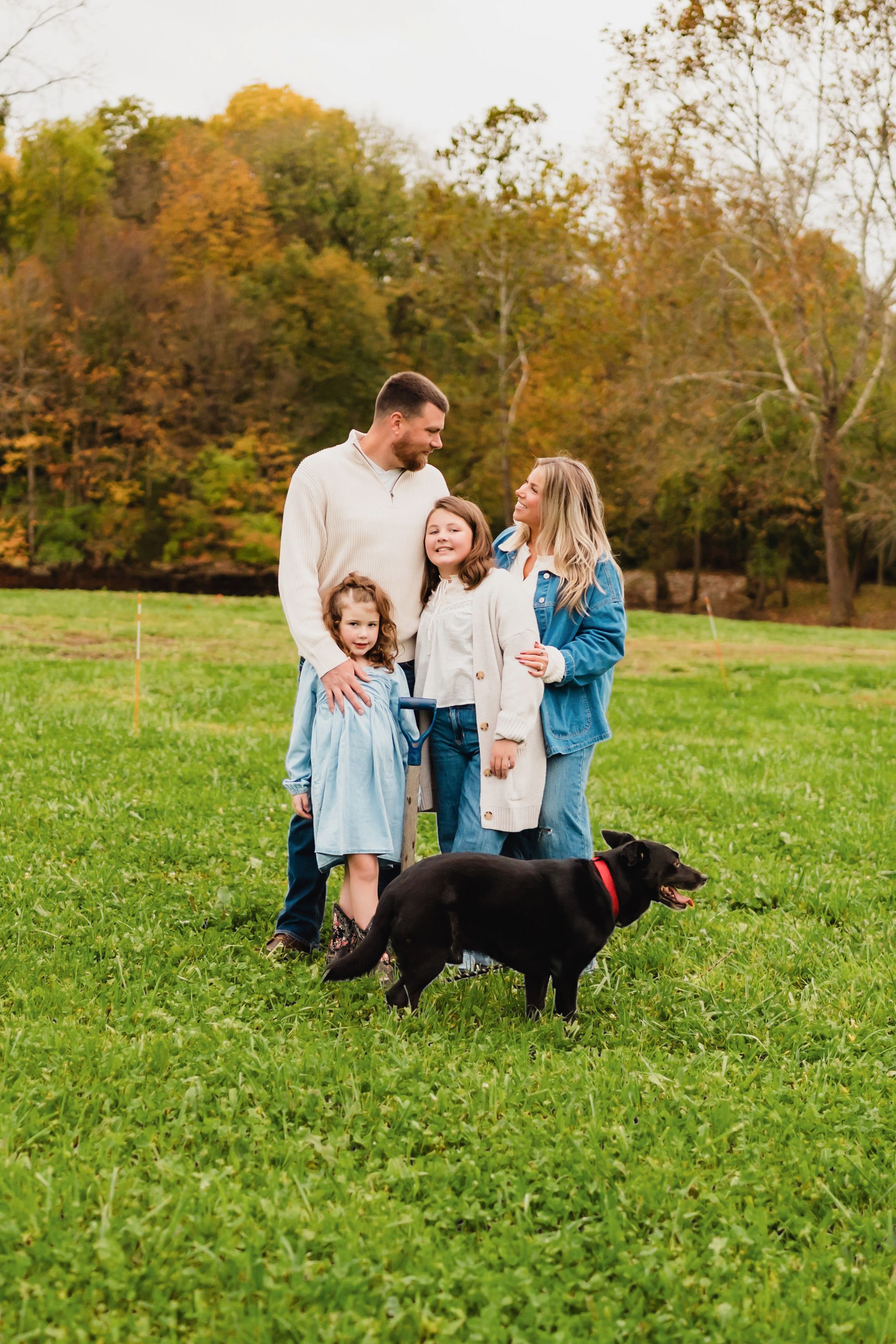 Documentary-style family photograph capturing the beginning of a home-building journey in Indiana.