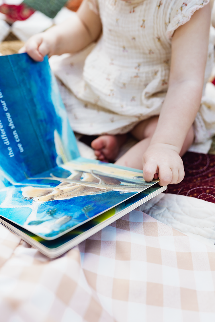 A close up image of a child looking at her favorite story.