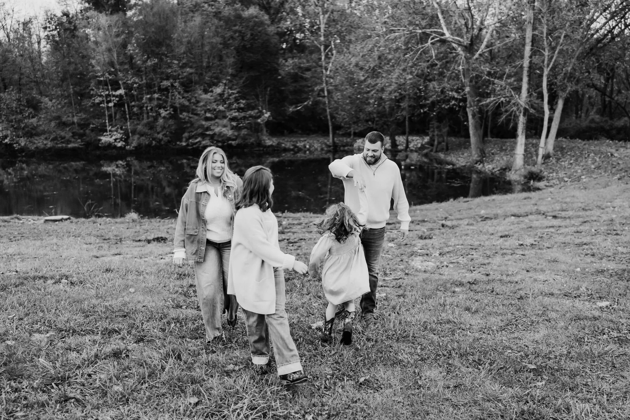 Family exploring their future homesite during a documentary family photography session.