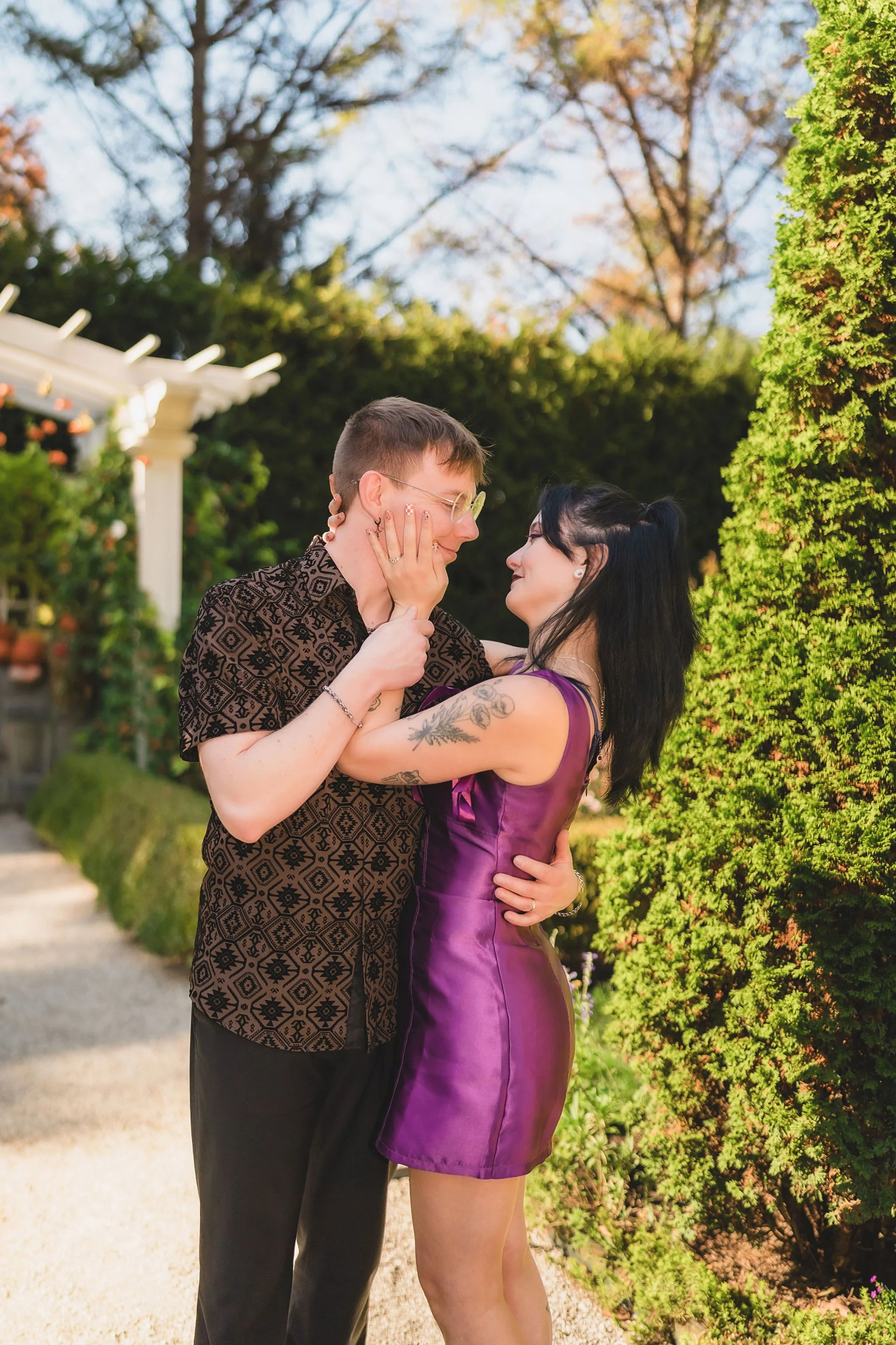 Indianapolis engagement photographer capturing candid portraits of a couple exploring the gardens at Newfields Museum