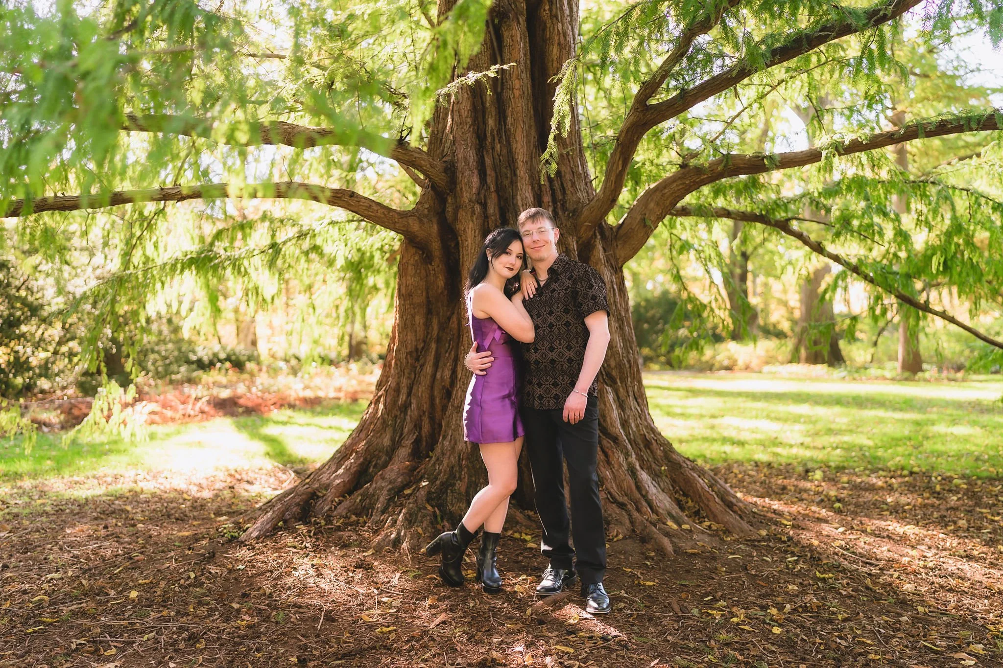 Candid engagement photos captured by an Indiana photographer among the garden paths at Newfields