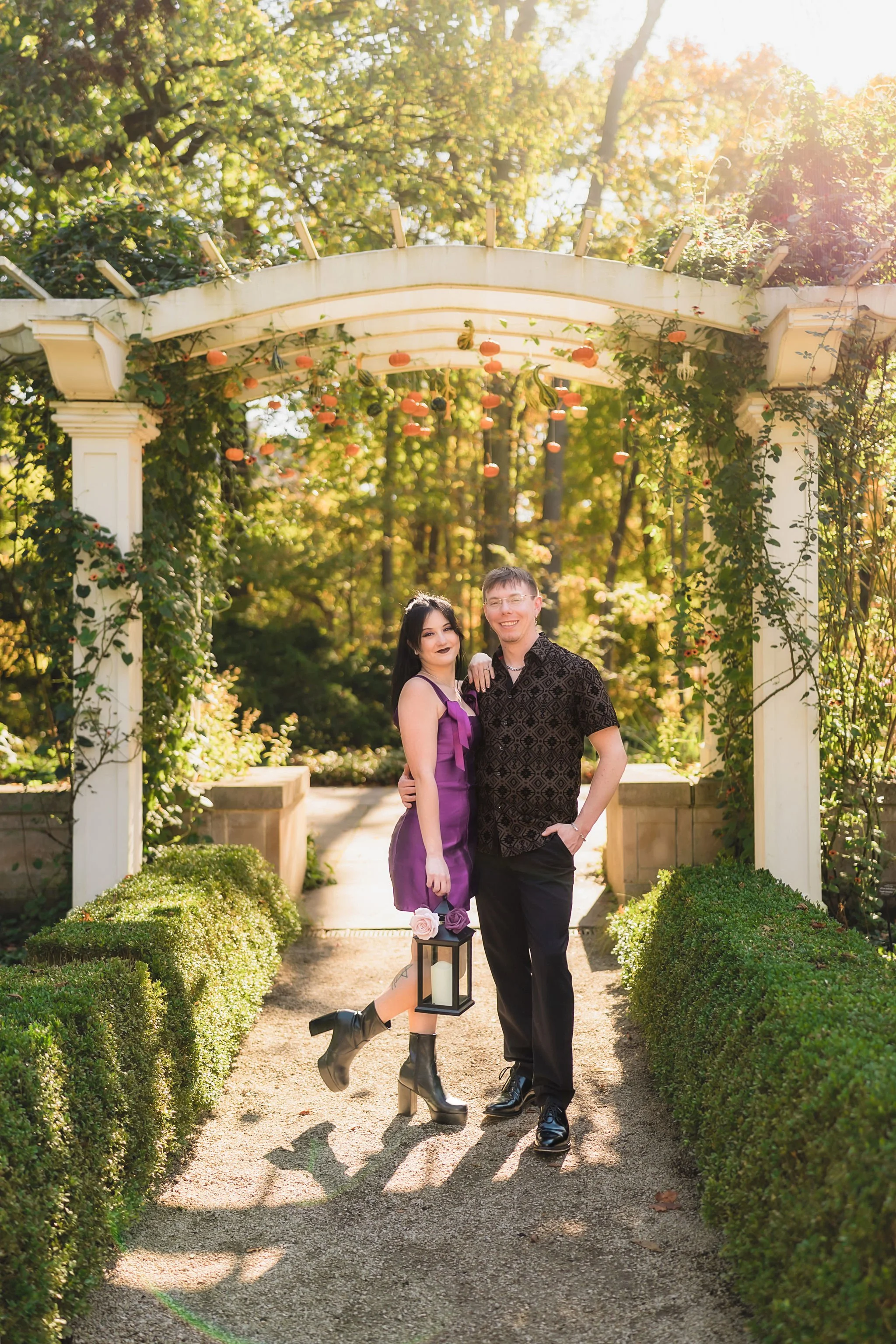 Indianapolis engagement photos featuring a couple exploring the scenic outdoor gardens at Newfields