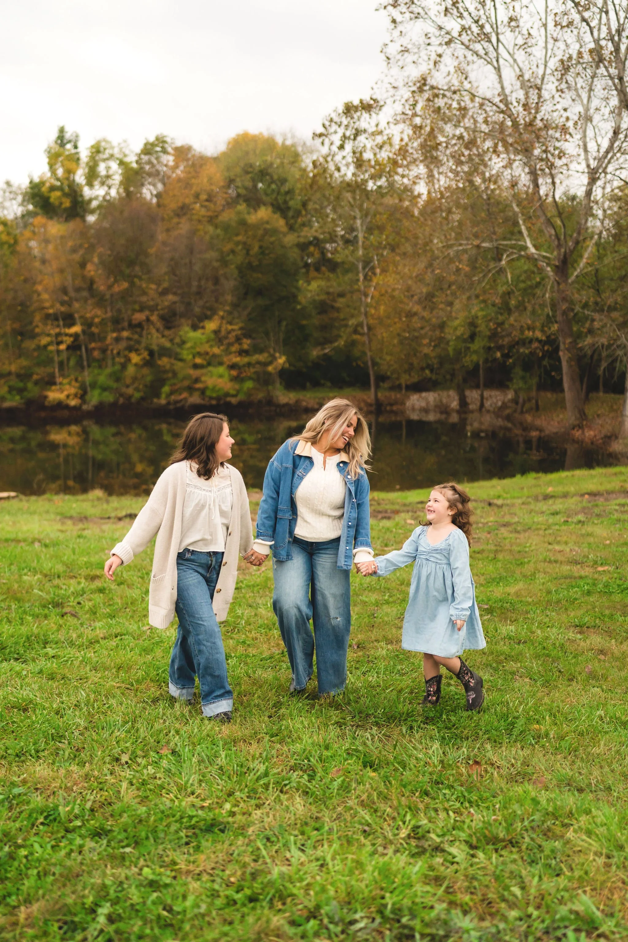 Mom and daughters sharing a moment with their daughters on the land they will soon call home.