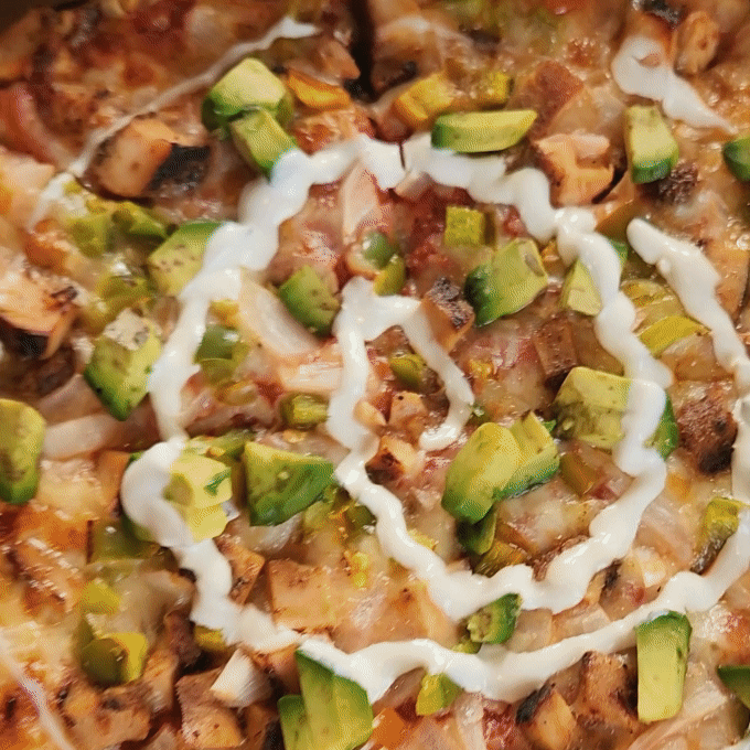 Pizza with avocado and sauce