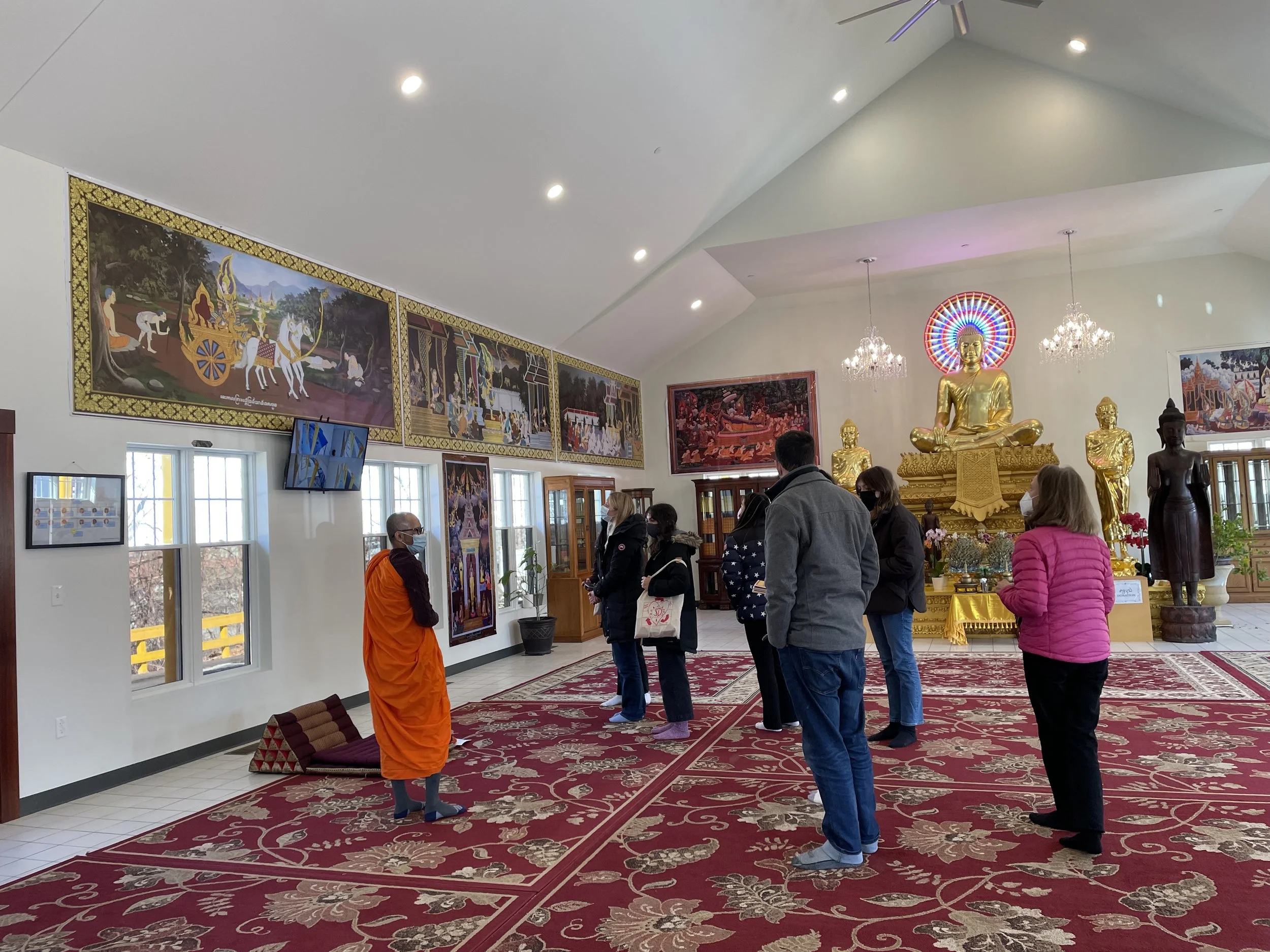 Listening to Jataka tales at Trairatanaram Temple.