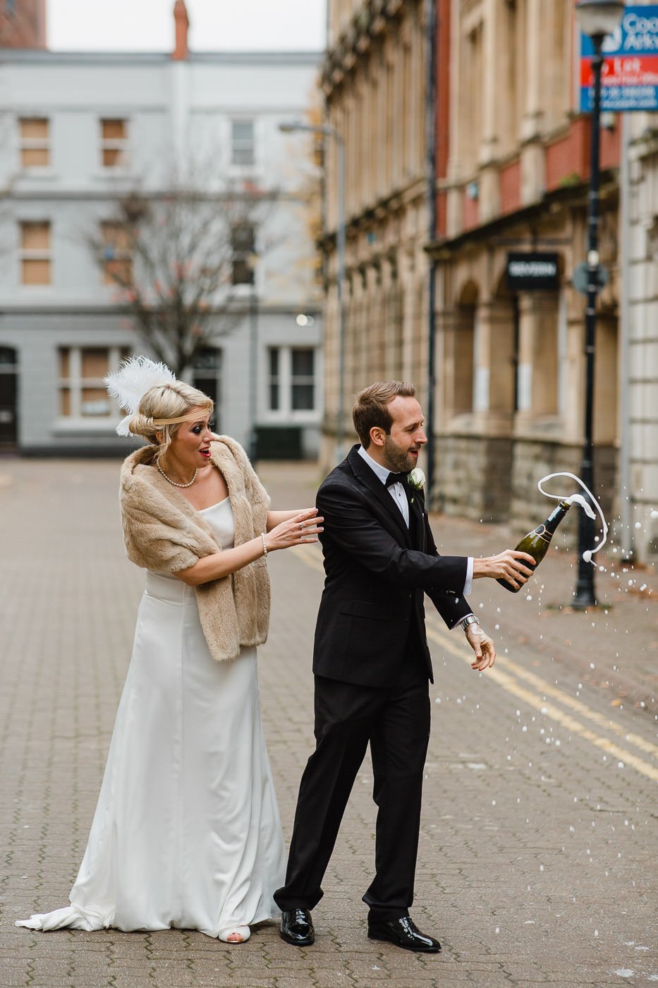 20-bride-groom-shaking-champagne-just-married-cardiff.jpg