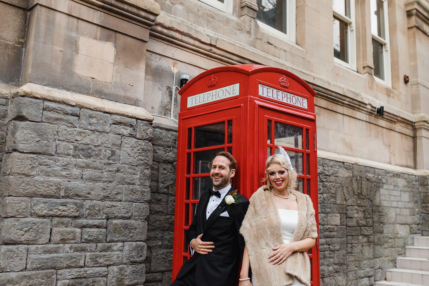 23-bride-groom-laughing-red-telephone-box.jpg