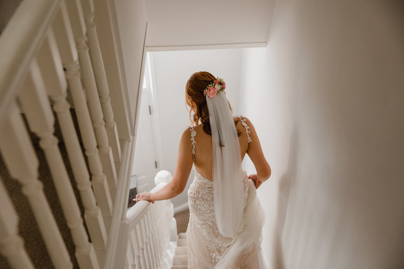 5-bride-walking-down-stairs-wedding-morning.jpg
