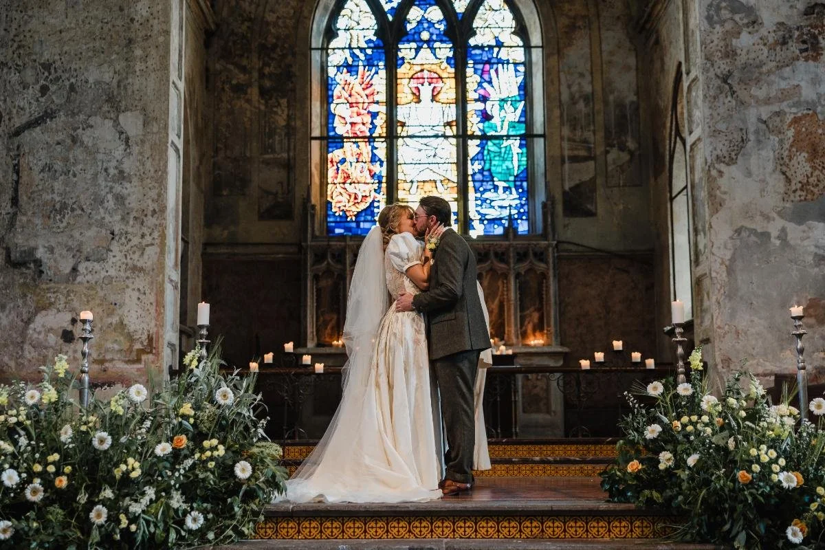 bride and groom first kiss at the mount without wedding ceremony