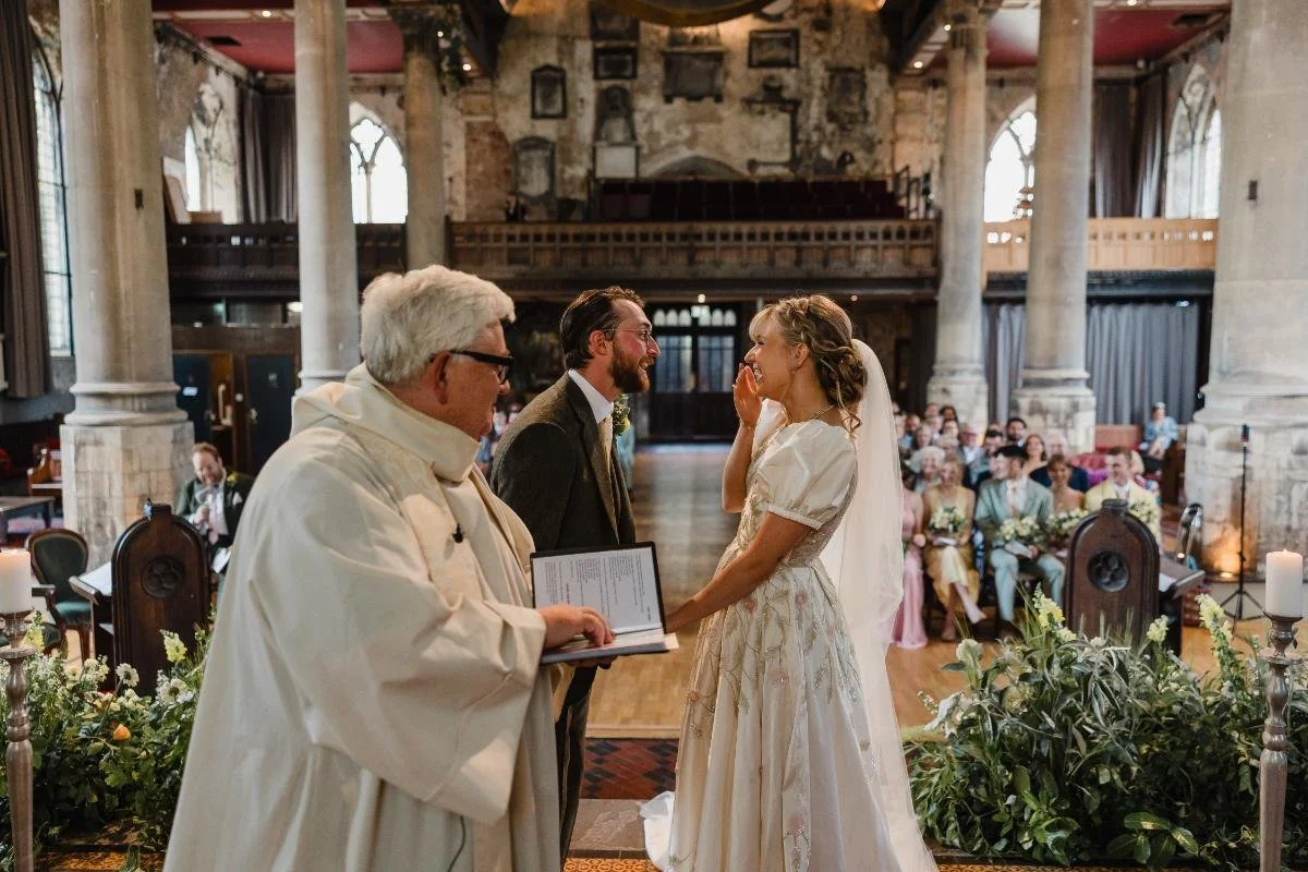bride and groom laughing during the wedding ceremony at the mount without