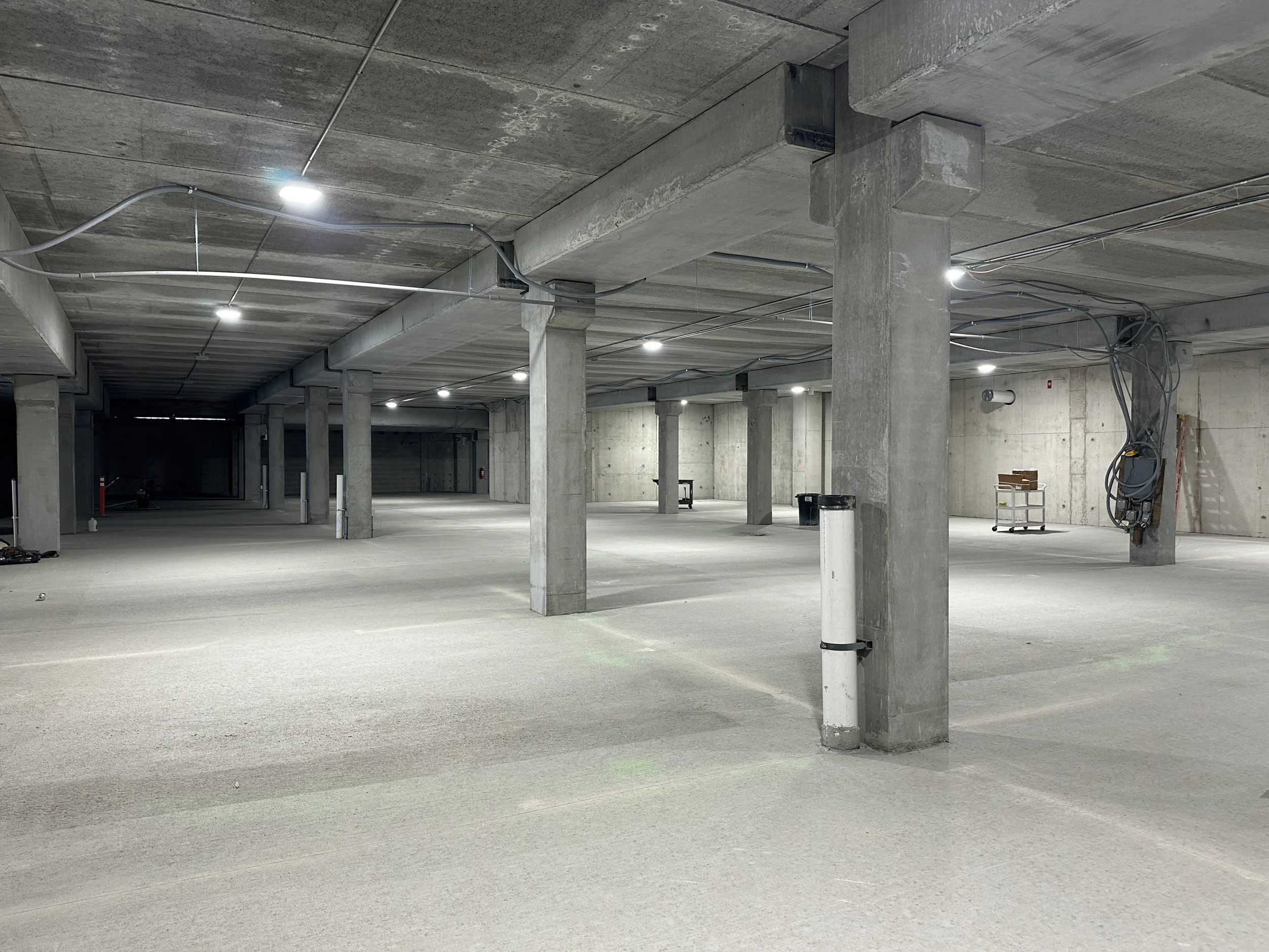 05.07.2026 - A section of the Luna/B1 parking garage with completed flooring.