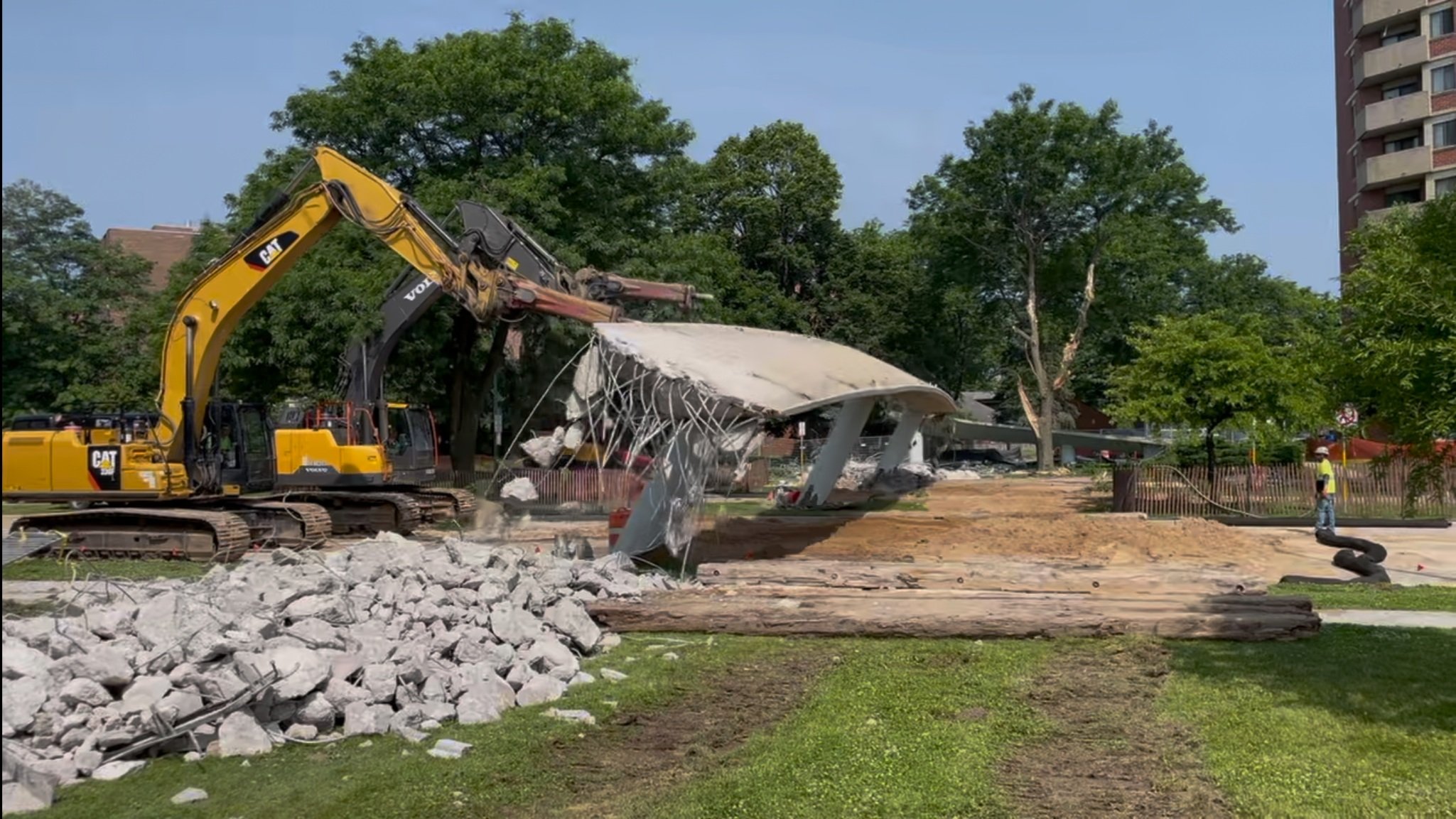 6.14.2025 - Crews demolish the pedestrian bridge next to Brittingham Apartments