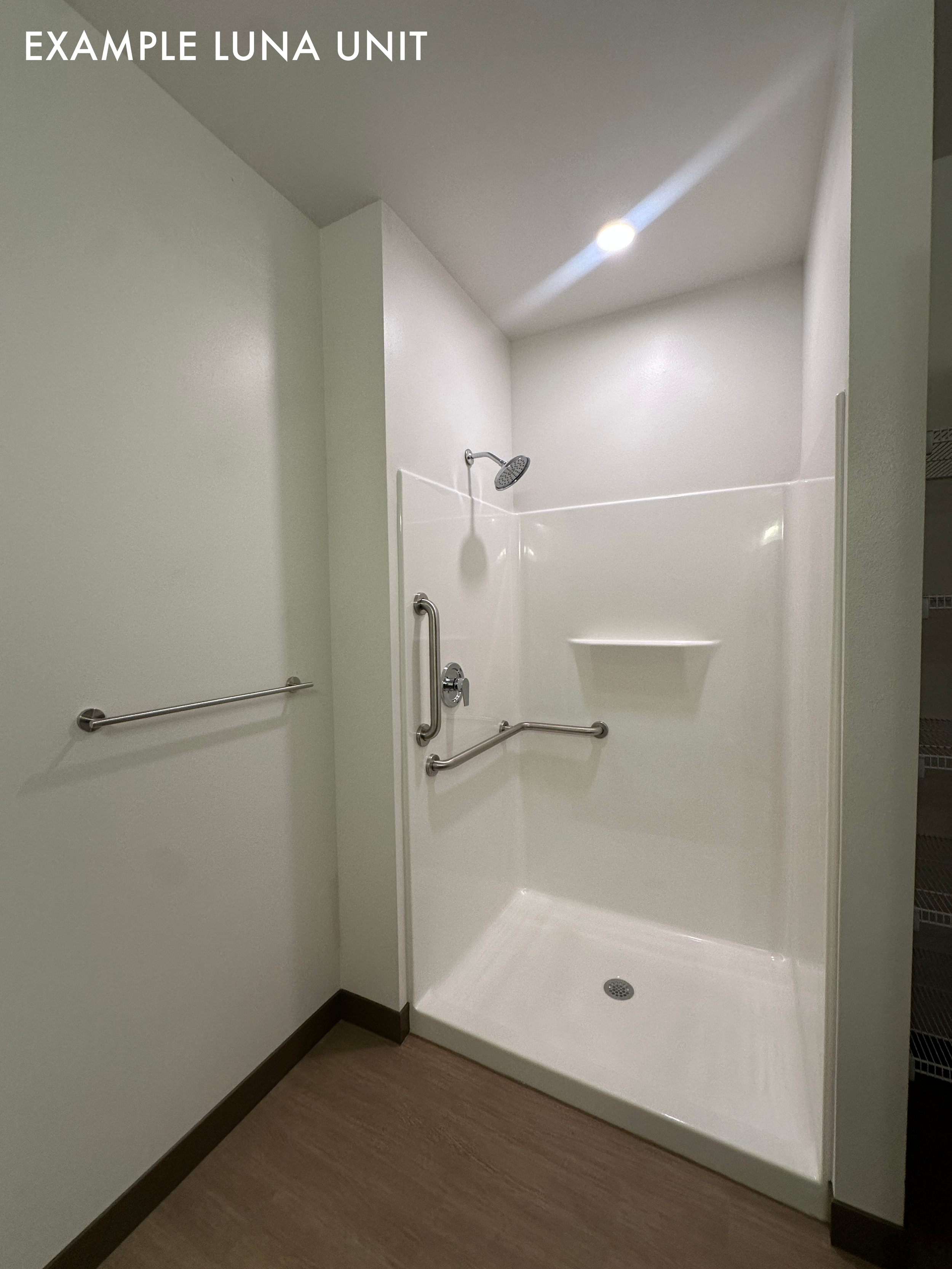Example Luna unit, bathroom view. The building has a mix of shower and shower/tub layouts.