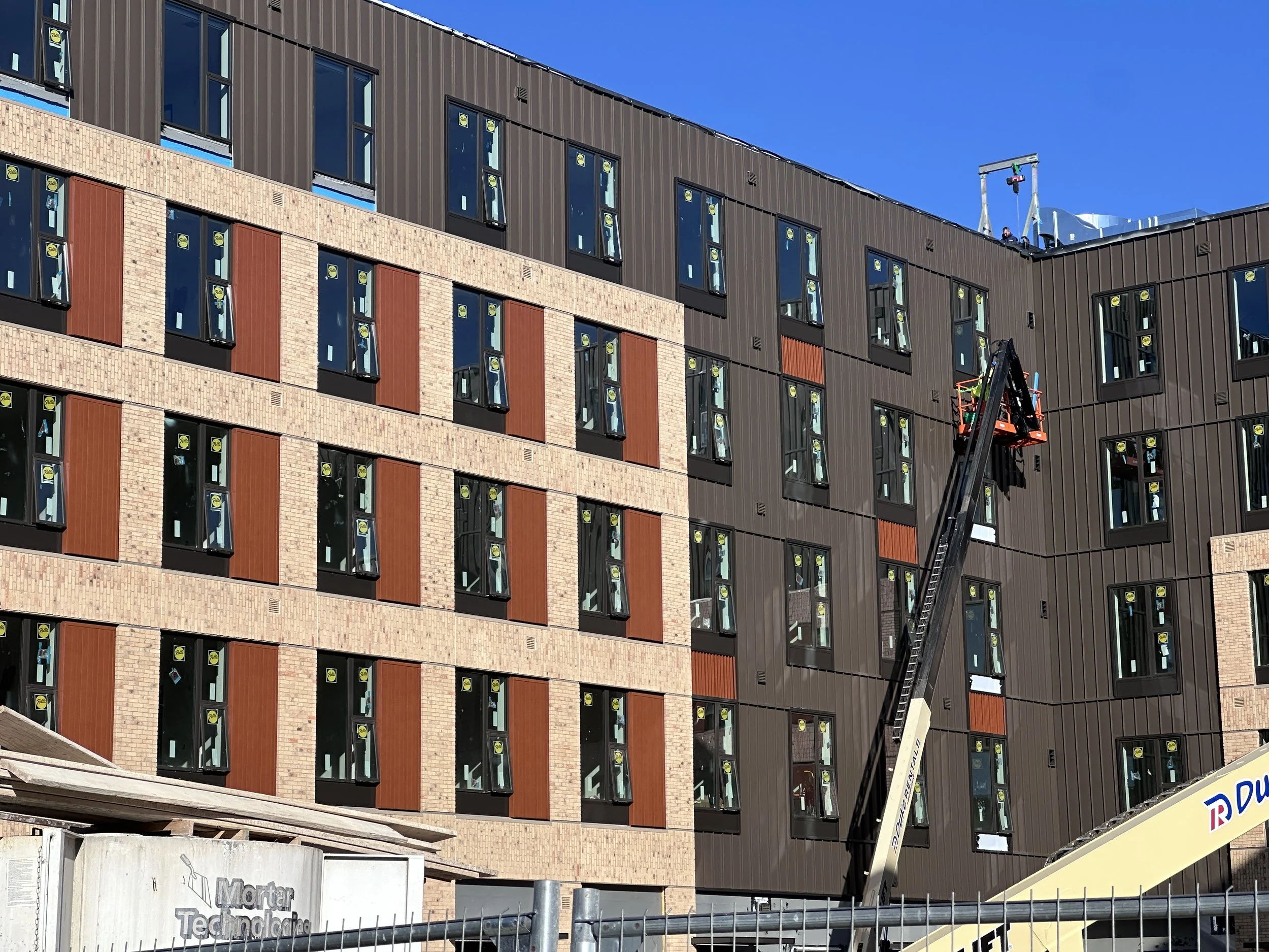 10.13.2026 - Metal paneling installation continues at Luna/B1.