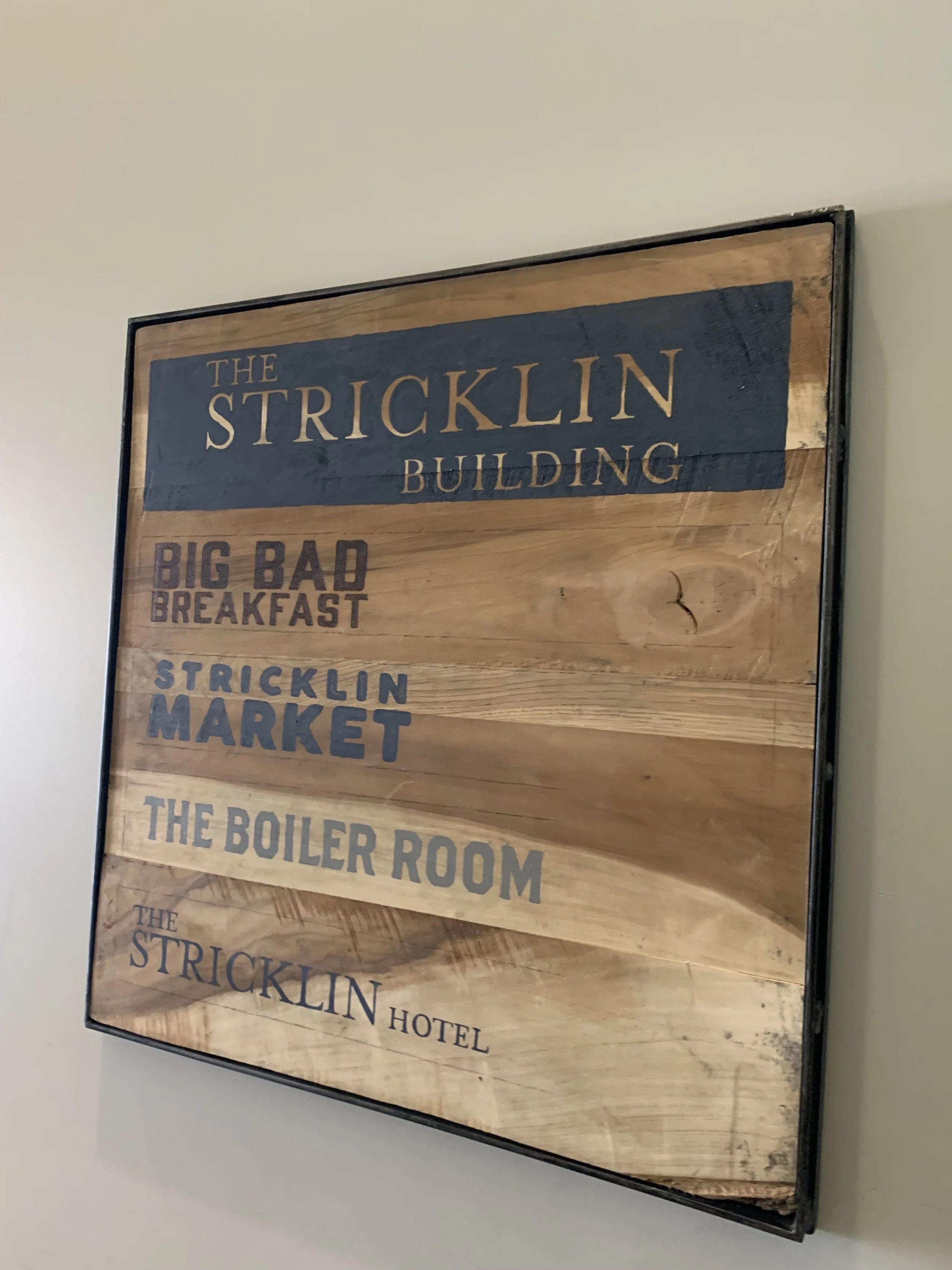 TB Design created framed wood piece. The text was painted by another artist.
