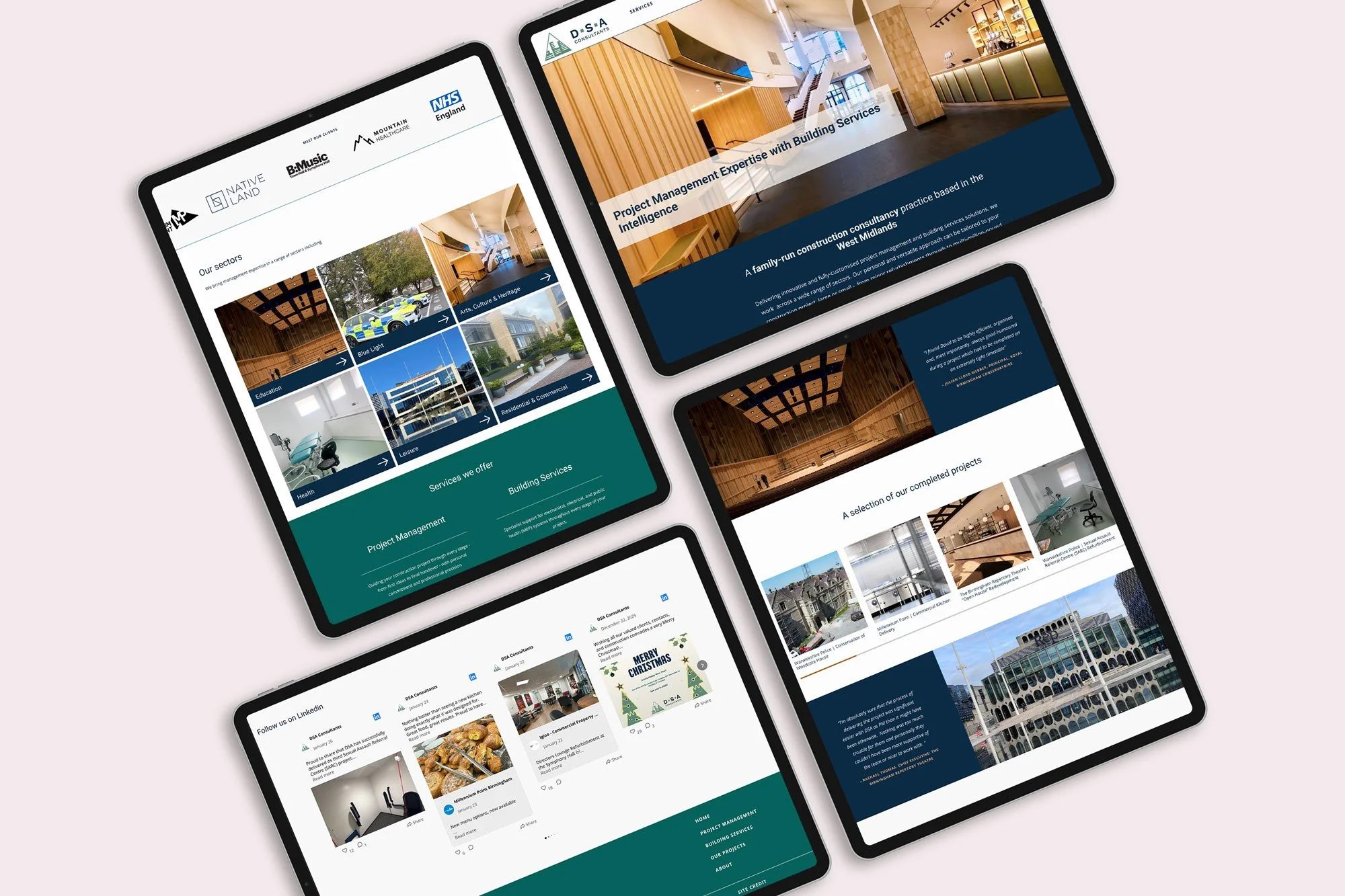 Flat lay of four iPads all showing a construction project management website in navy and teal hues.