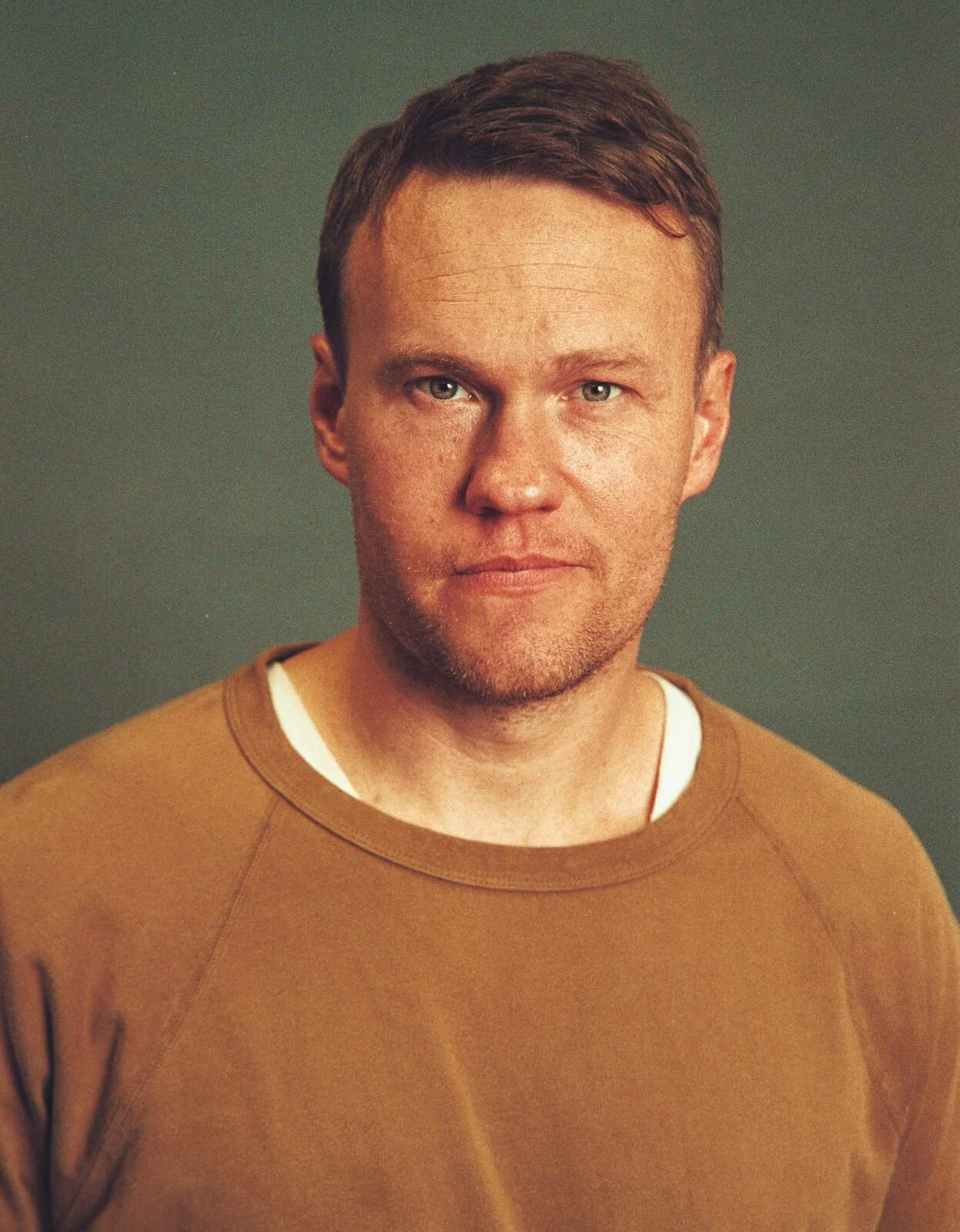 Alvin Cowan, founder of Simpatico Media, in a rust-colored shirt.