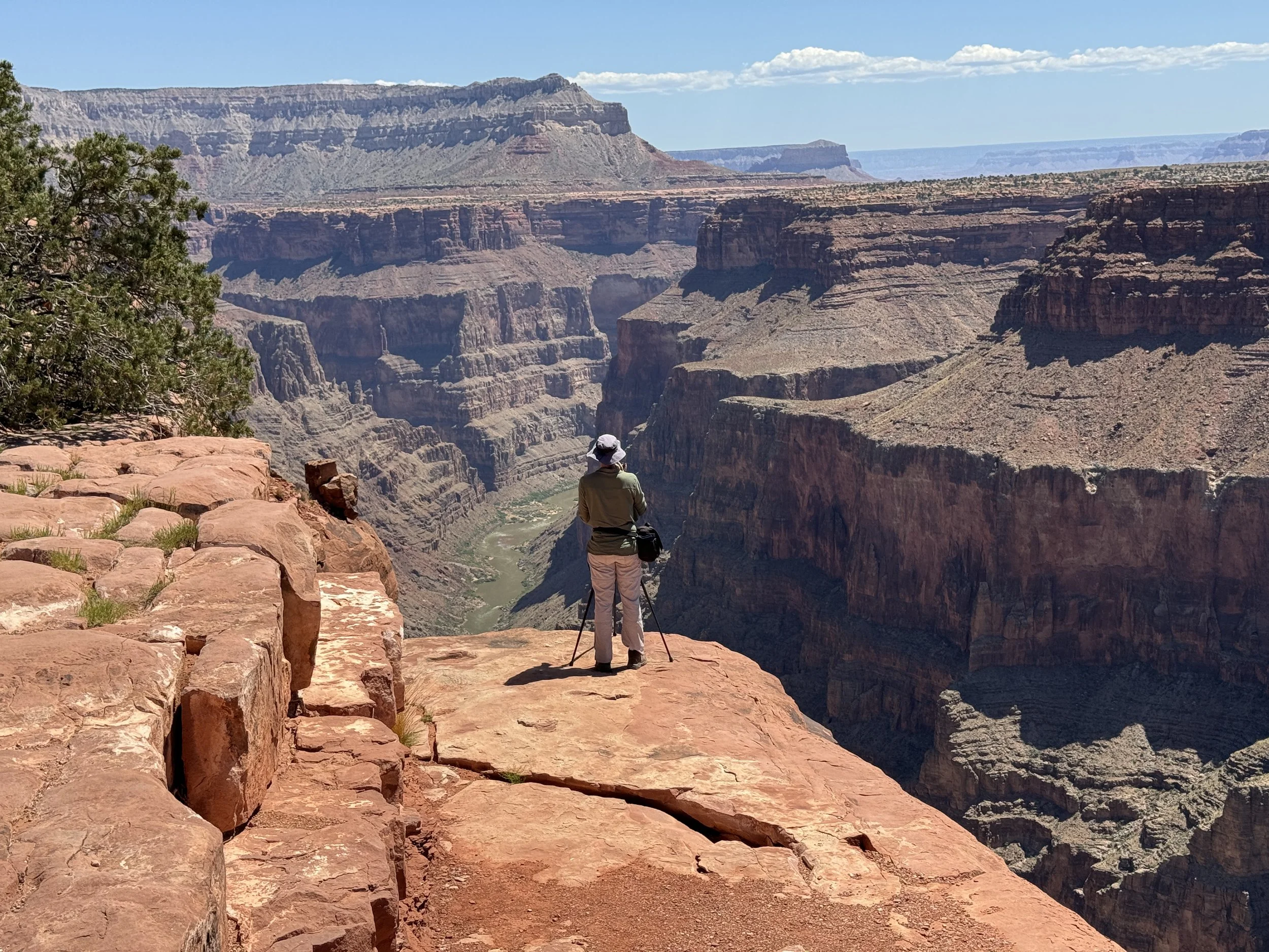Solo traveler on the edge of the Grand Canyon at Toroweap