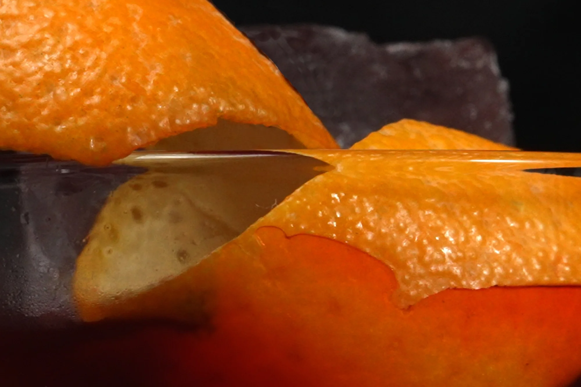 Close up of a Orange Slide on a cocktail glass