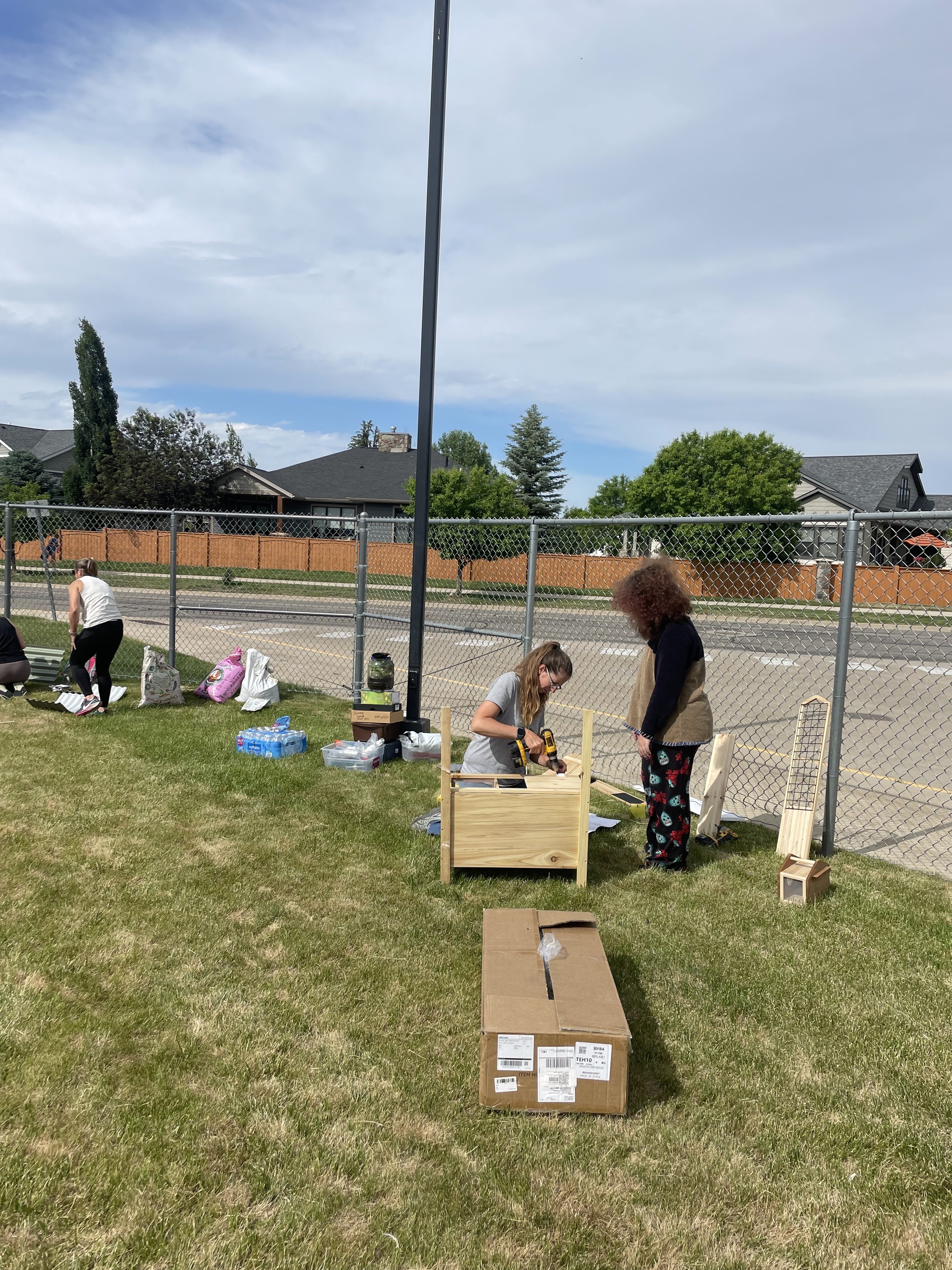 Volunteers assembling the outdoor wash station.