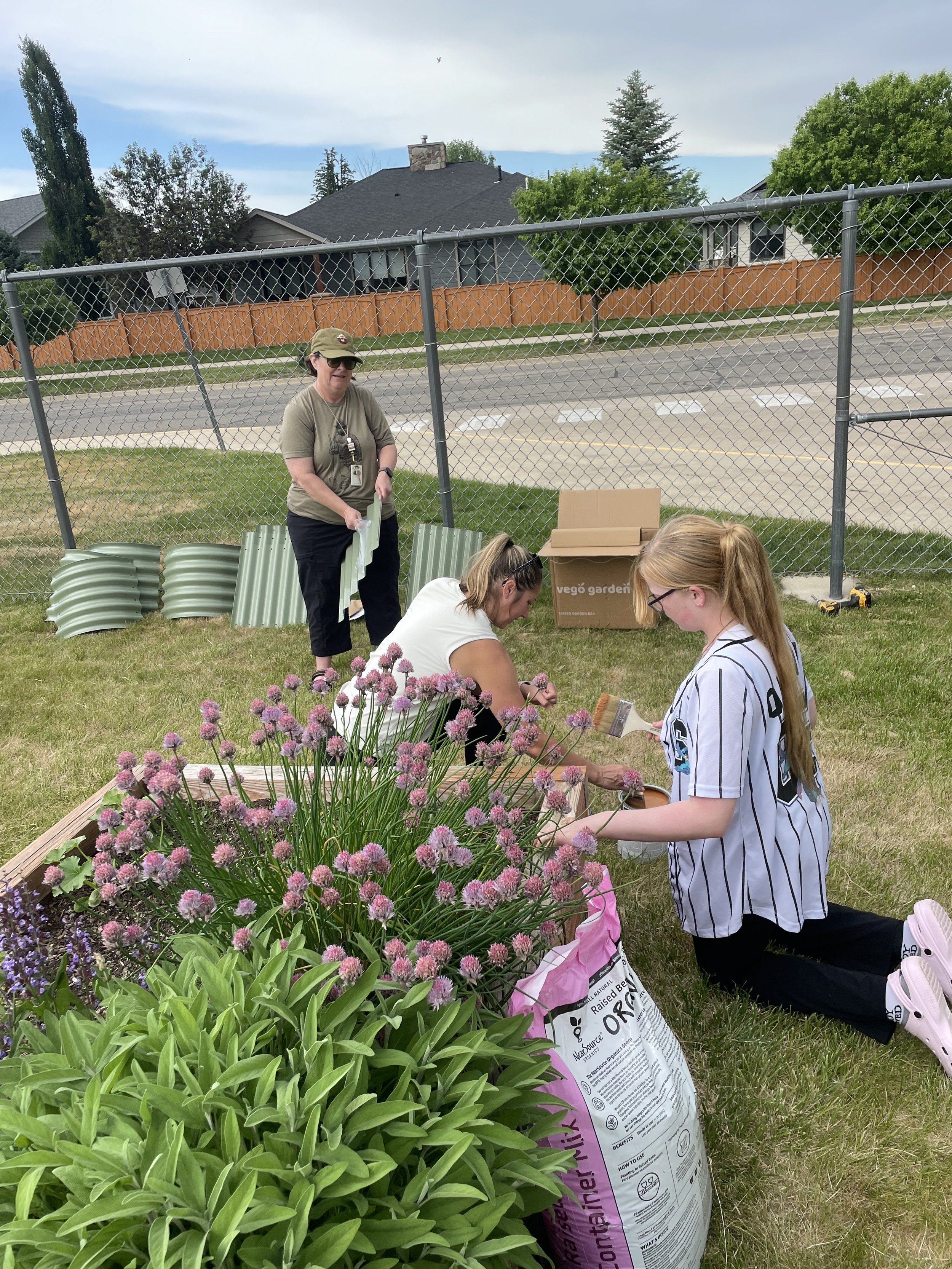 Volunteers helping refurbish the garden bed.
