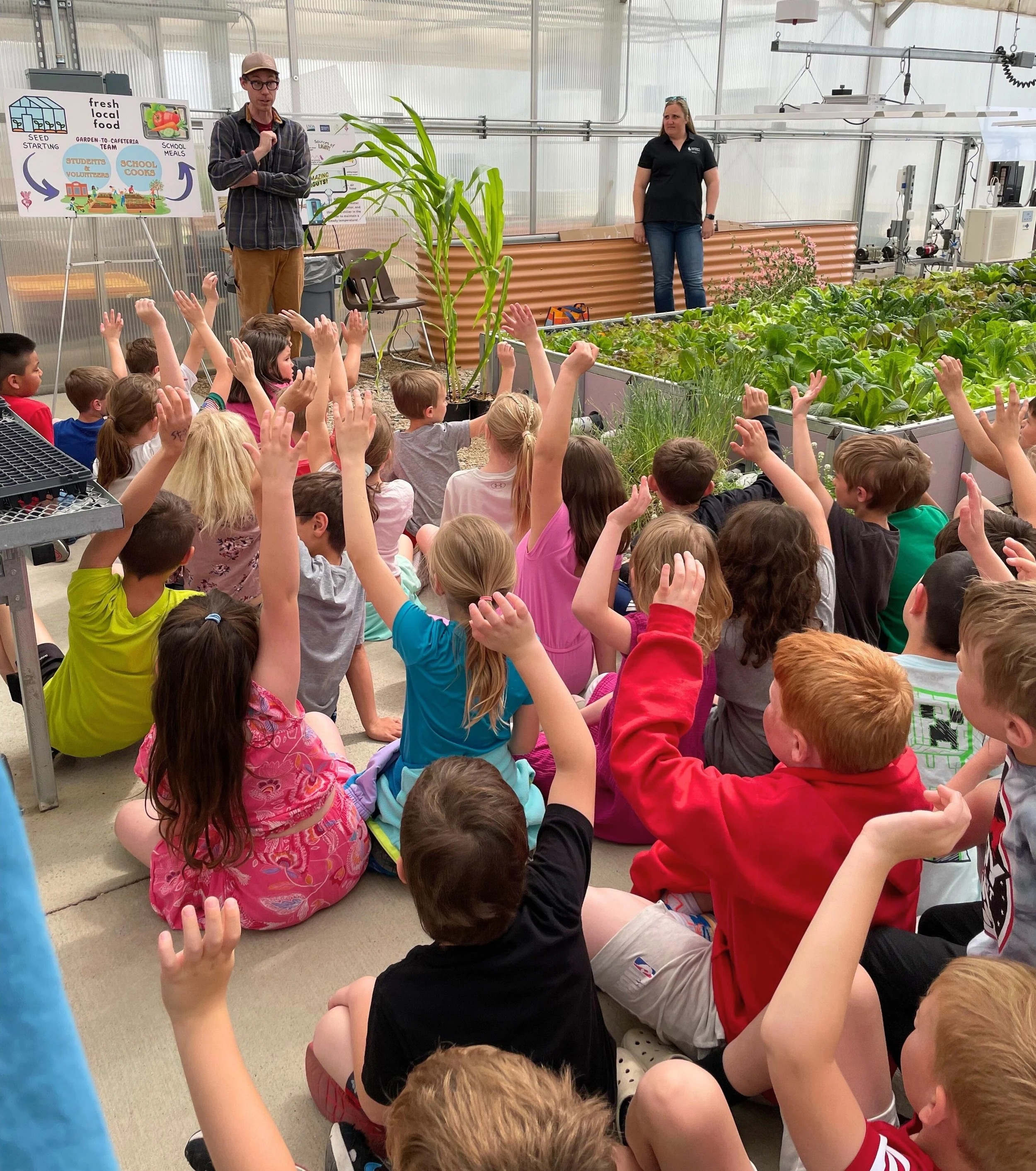 Rooted in Wyoming teaching a large class elementary school students about the food system.