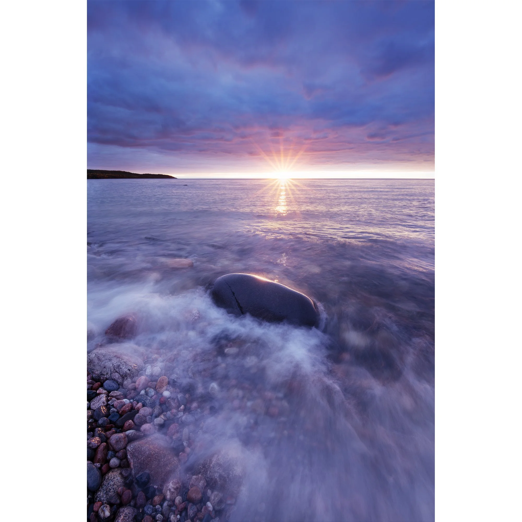 Pink Sunset Over Rocky Shoreline at Alona Bay