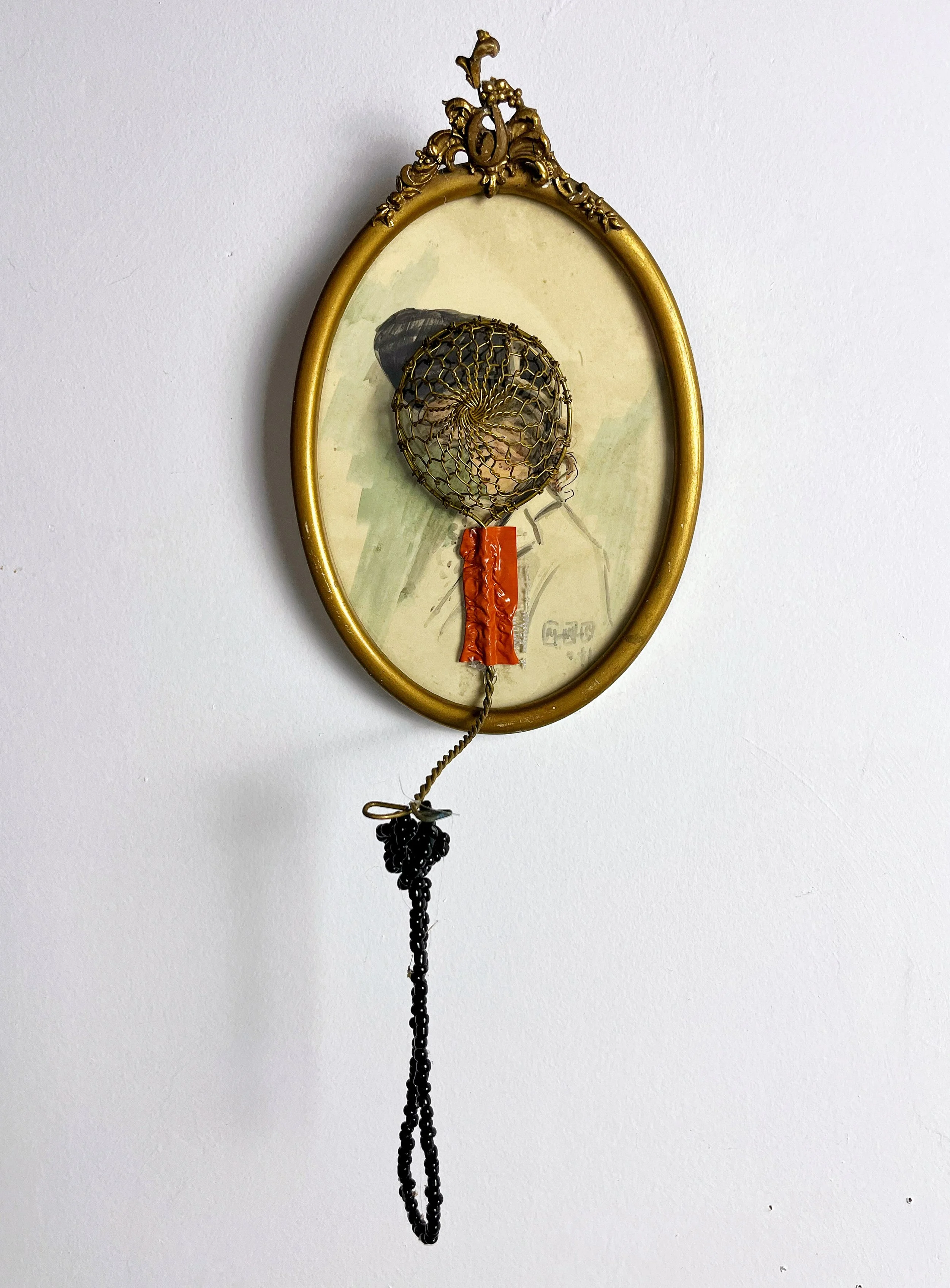 "A TRAP", Framed Vintage portrait sketch of woman, brass wire sieve, strand of black beads. 14 X 6 X 5 inches