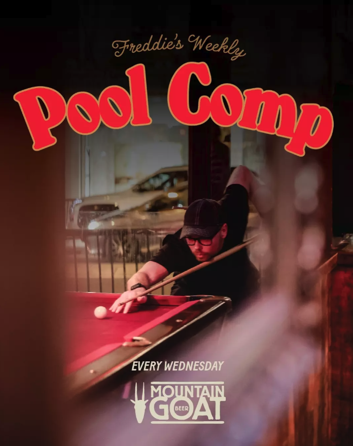 A man playing pool at a bar, with a sign for Freddie's Weekly Pool Comp and Mountain Goat Beer, indicating it's held every Wednesday.