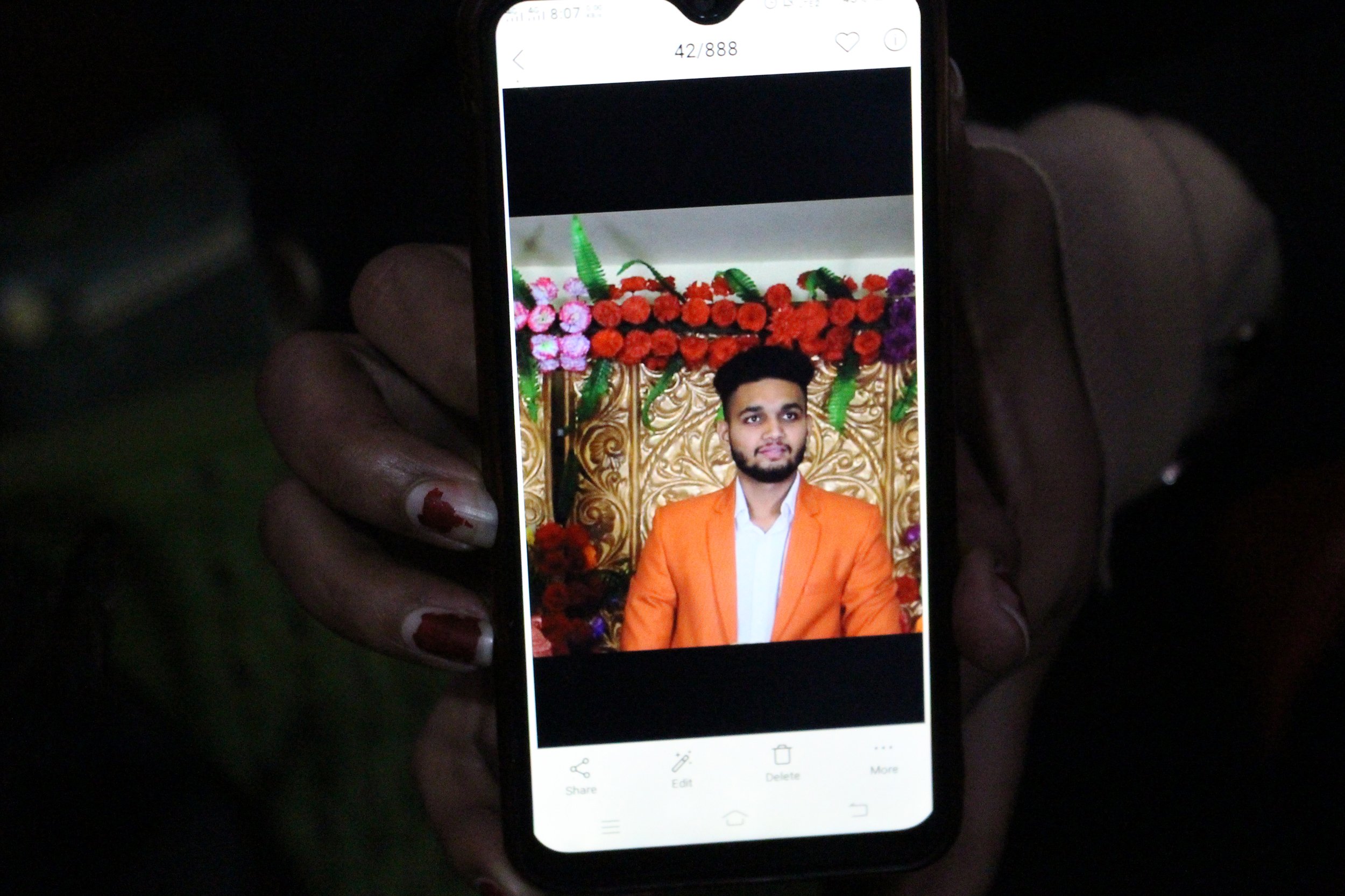  Anjali shows a photo of her future husband, who she is marrying the next day. She is lucky to have seen a photo beforehand, and though she is nervous, she thinks he is handsome. | Photo by Anna Kapsner 
