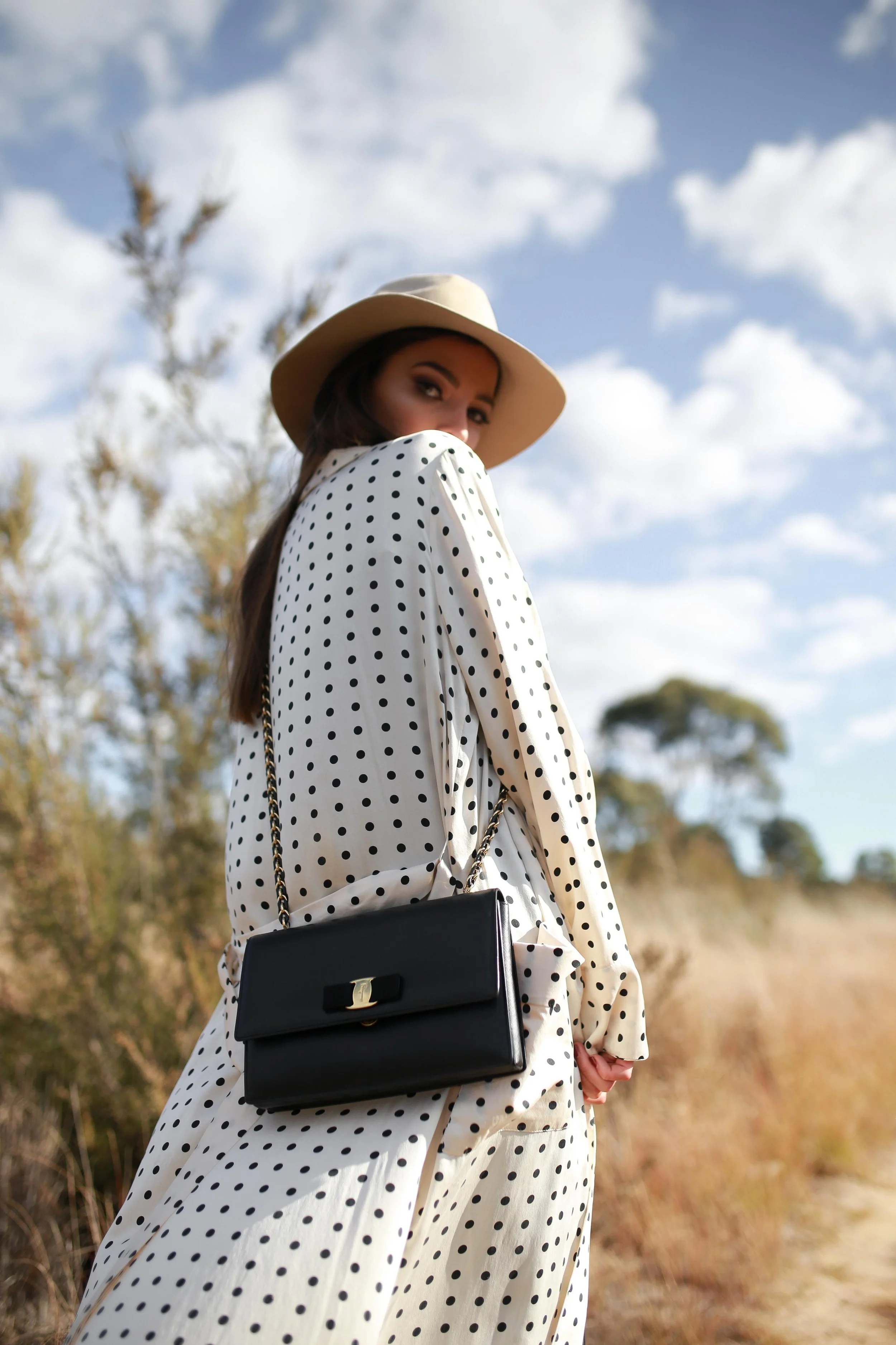 woman with a white dress and purse