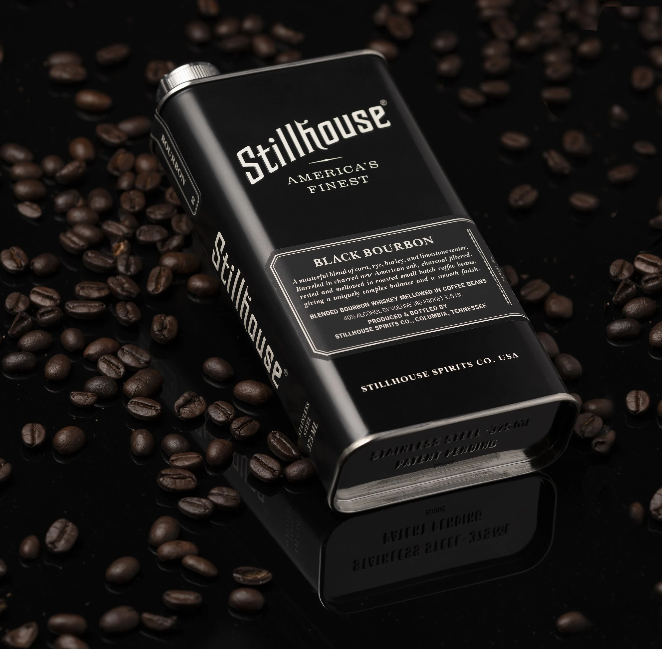 Dark product photography of Stillhouse Black Bourbon with coffee beans, Sacramento commercial photographer