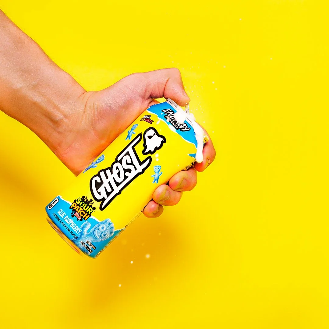 Commercial product photography of Ghost Energy x Sour Patch Kids can being opened with liquid motion effect, shot by Mad Lad Visuals in Elk Grove California