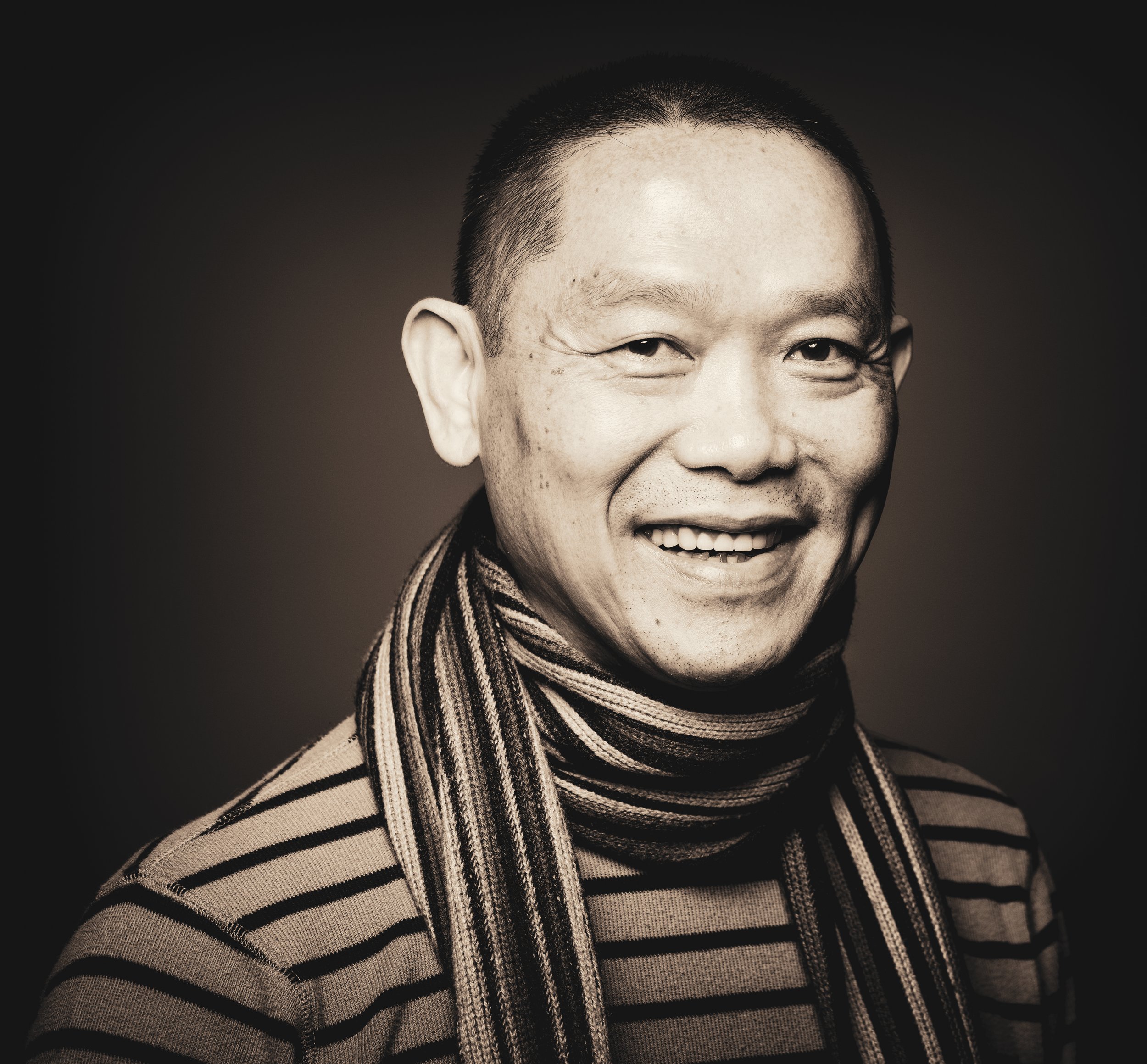 Black and white corporate headshot of a professional man with glasses in Sacramento