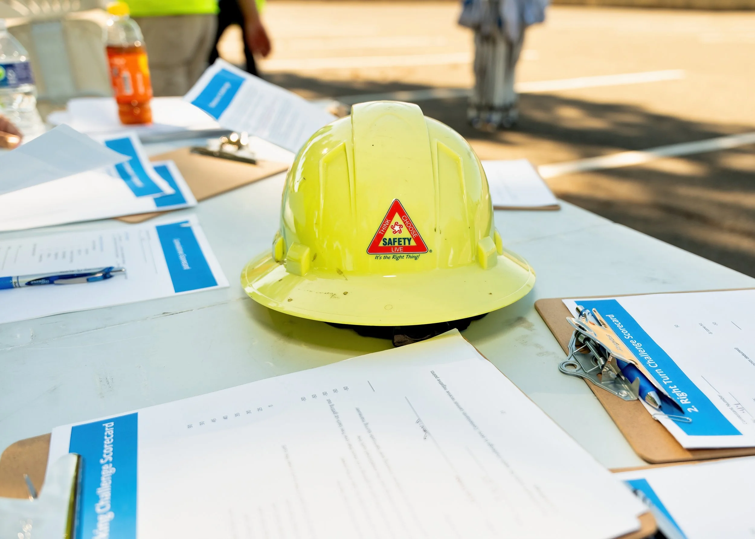 Yellow hardhat and clipboards detail shot at Republic Services Road-eo event Sacramento