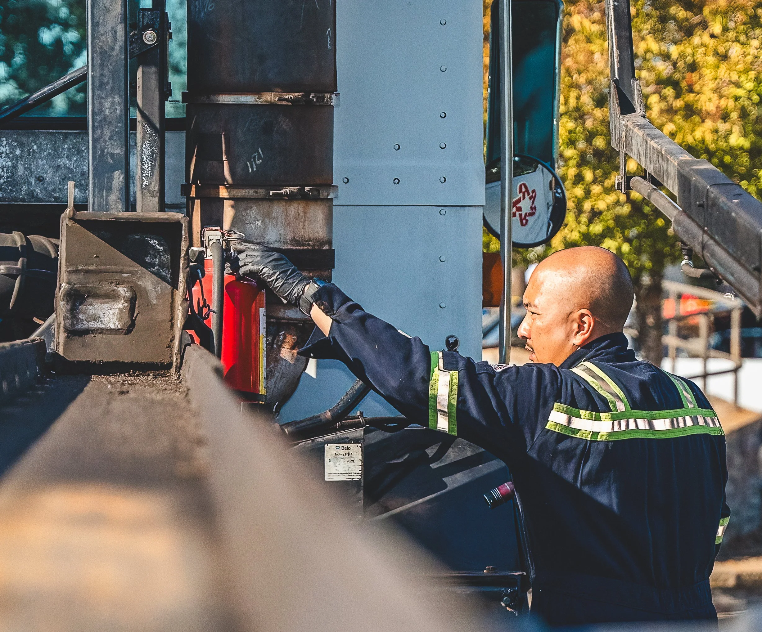 Technician checking equipment on a service truck during on-site work