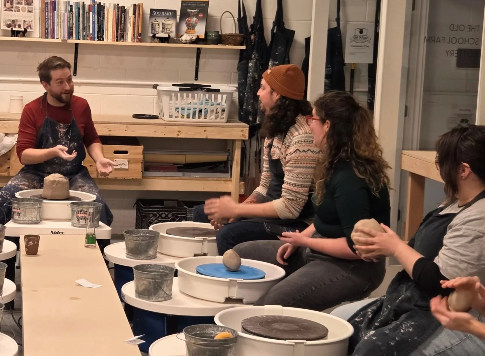 Studio Director, Brad, instructing community members on a pottery game. At Old School Farm Pottery, a nonprofit Nashville Pottery